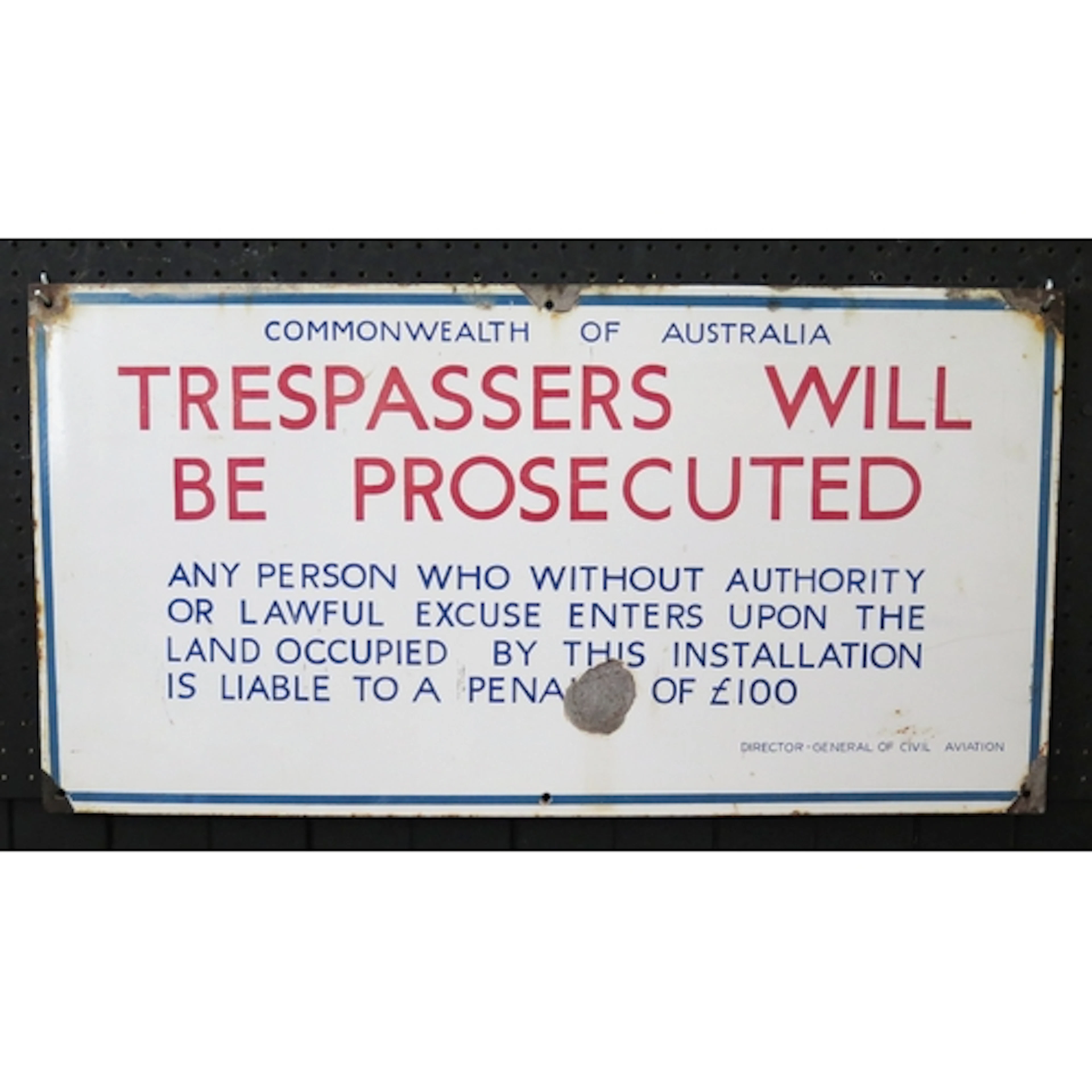 Commonwealth of Australia enamel advertising sign "Trespasse...