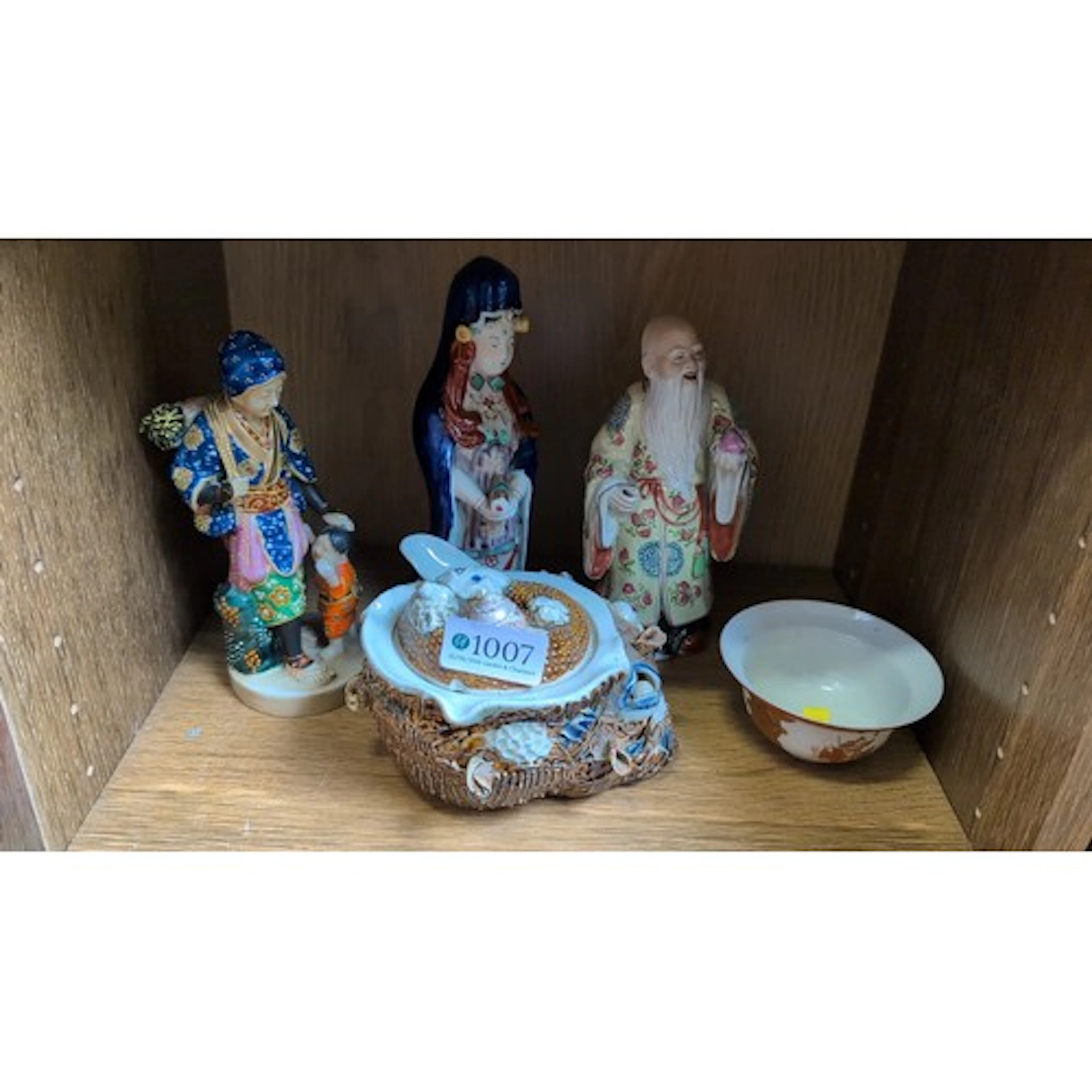 A group of Asian ceramics comprising three polychrome porcel...