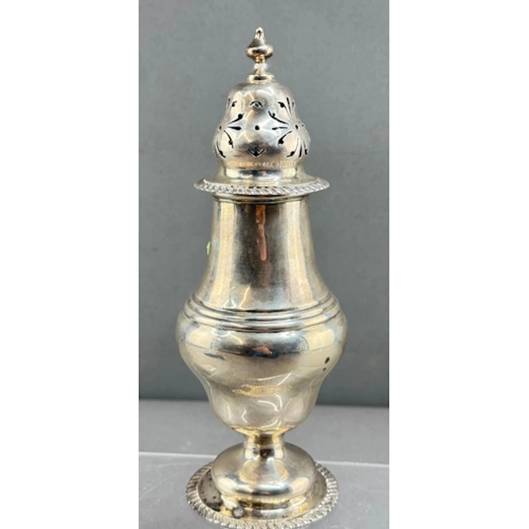 Silver: a pedestal baluster caster by R & S Garrard &...