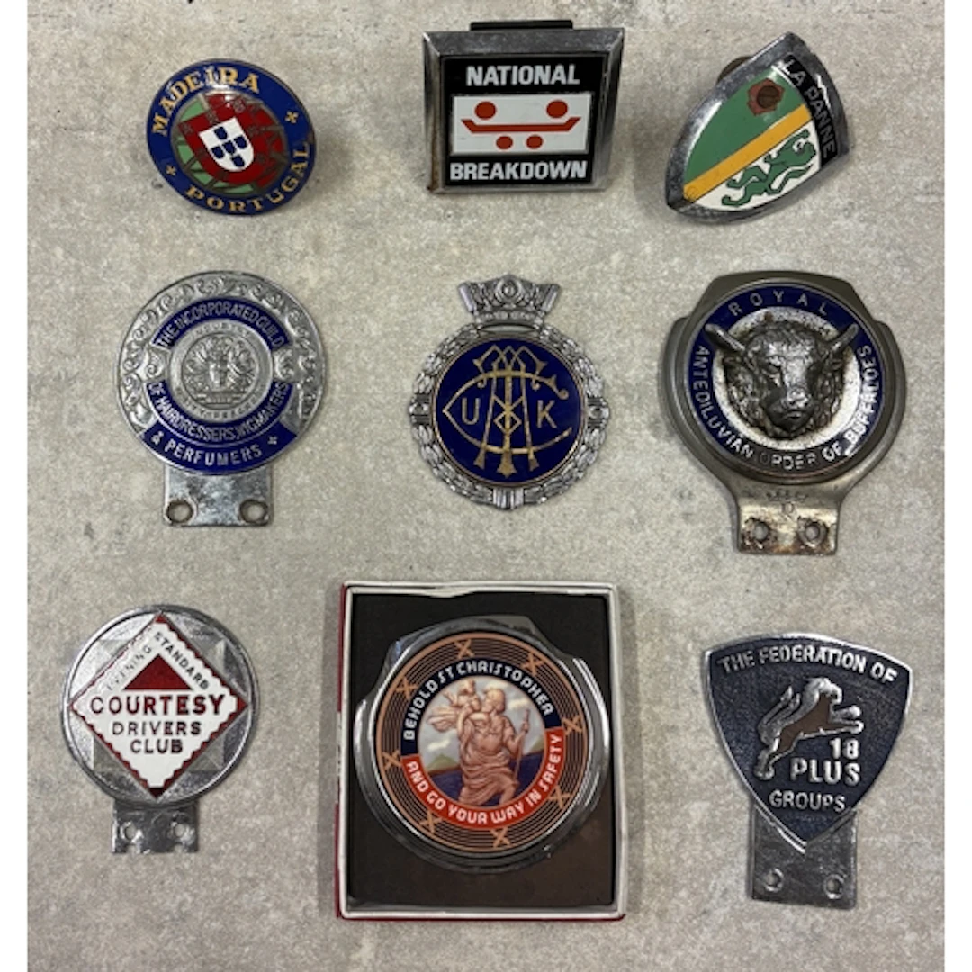 A collection of nine car badges to include The Incorporated ...