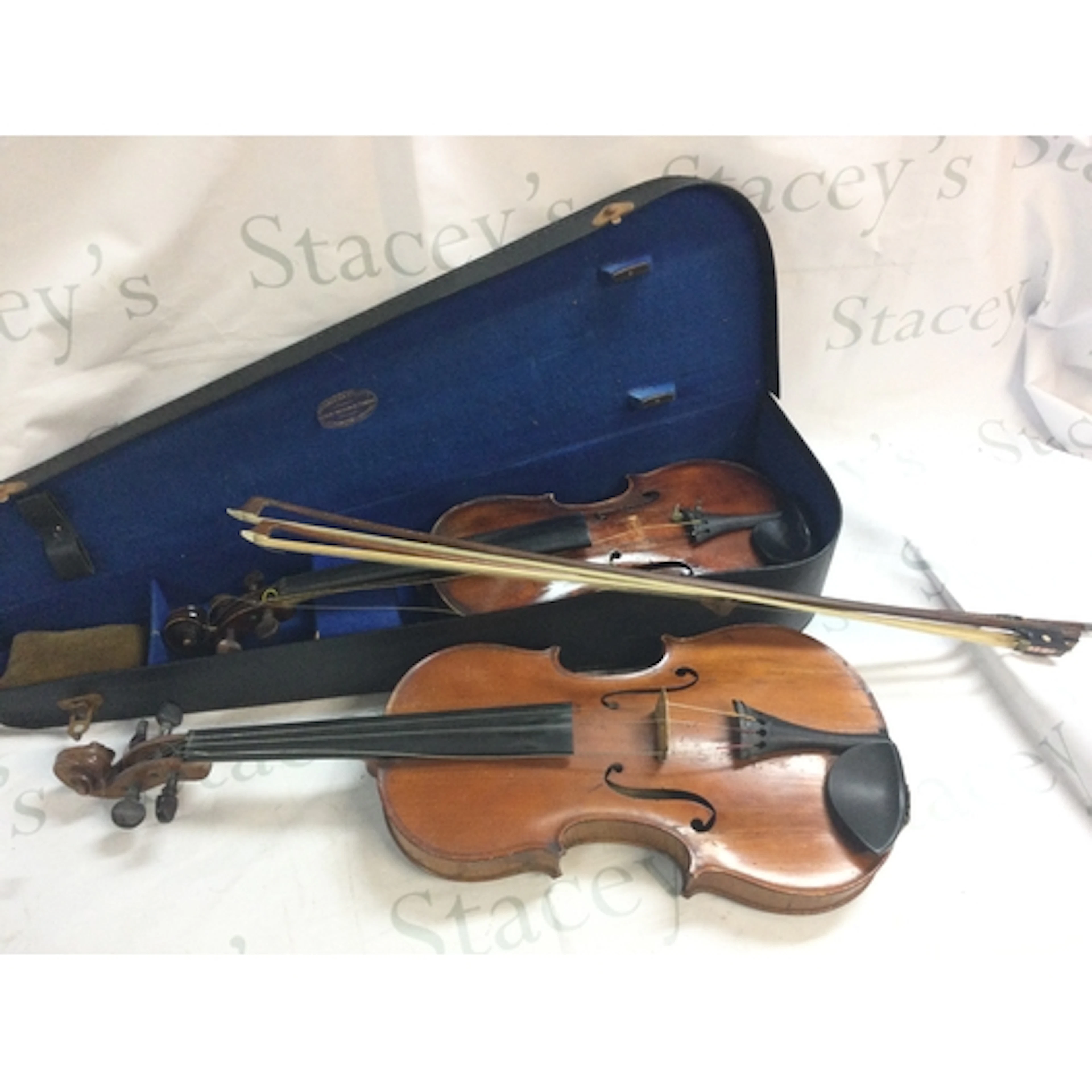 viola/ violin with two bows , cased violin. Label reads The ...