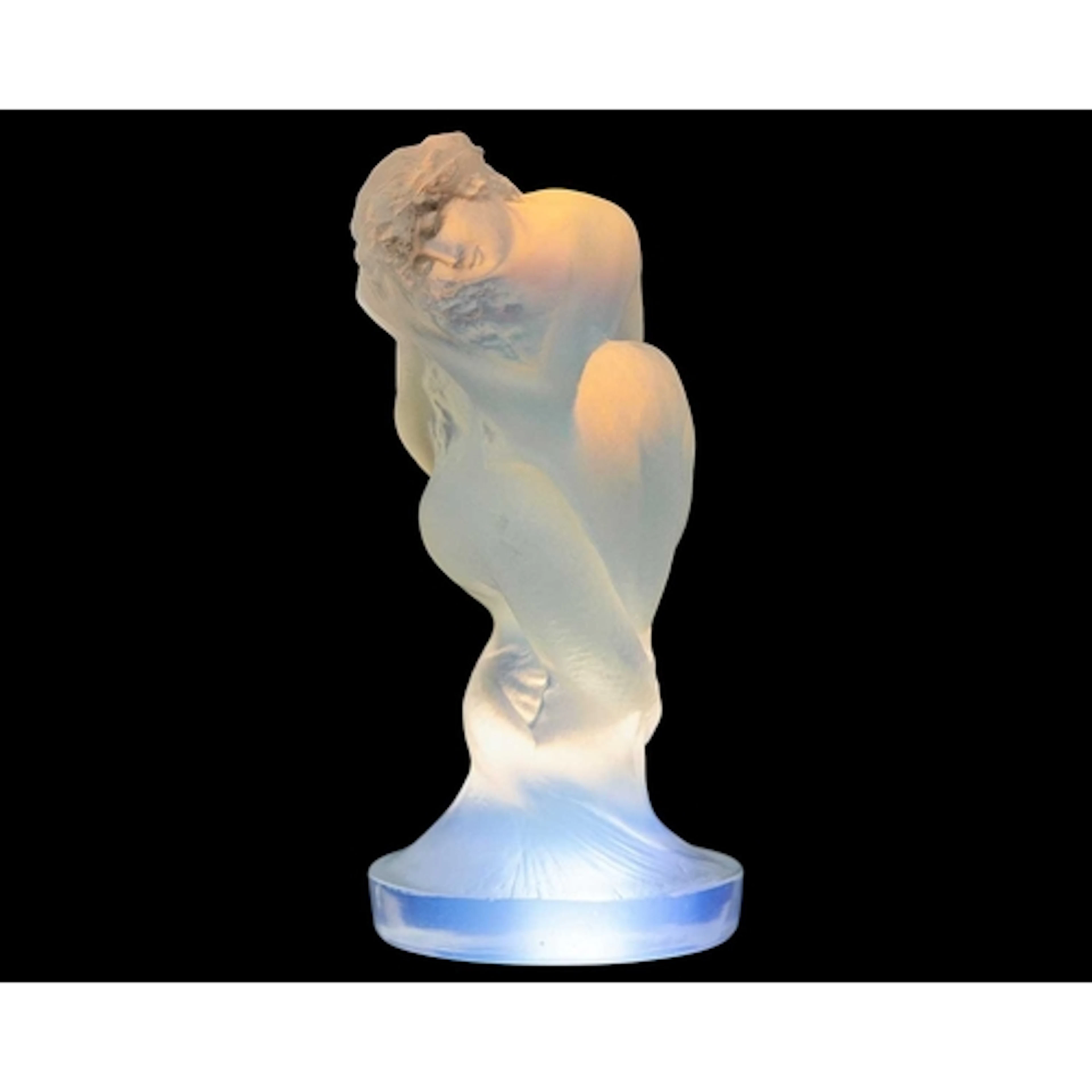 Serene, a Rene Lalique opalescent glass car mascot. Designed...