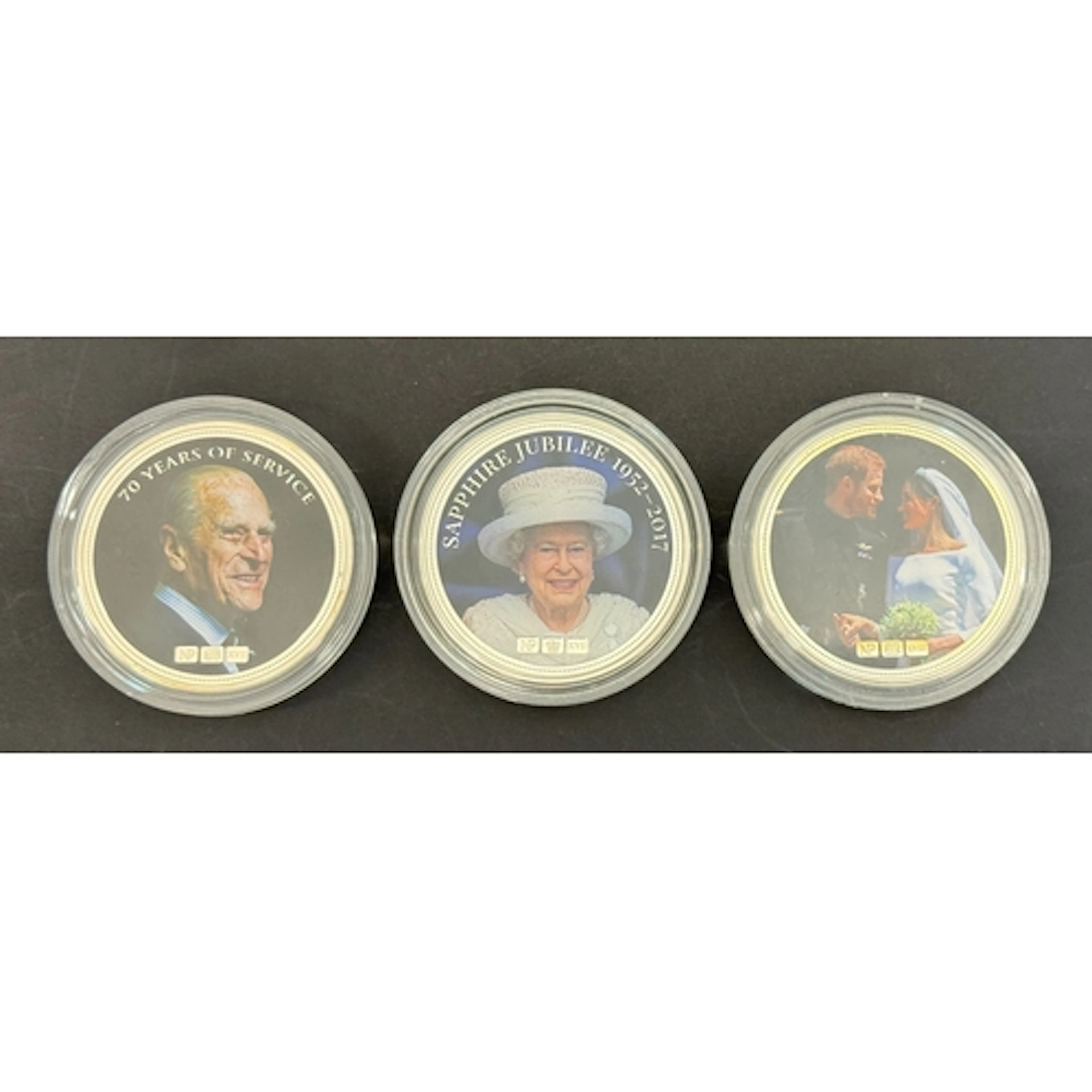 A group of three modern colourised royalty-themed two-ounce ...