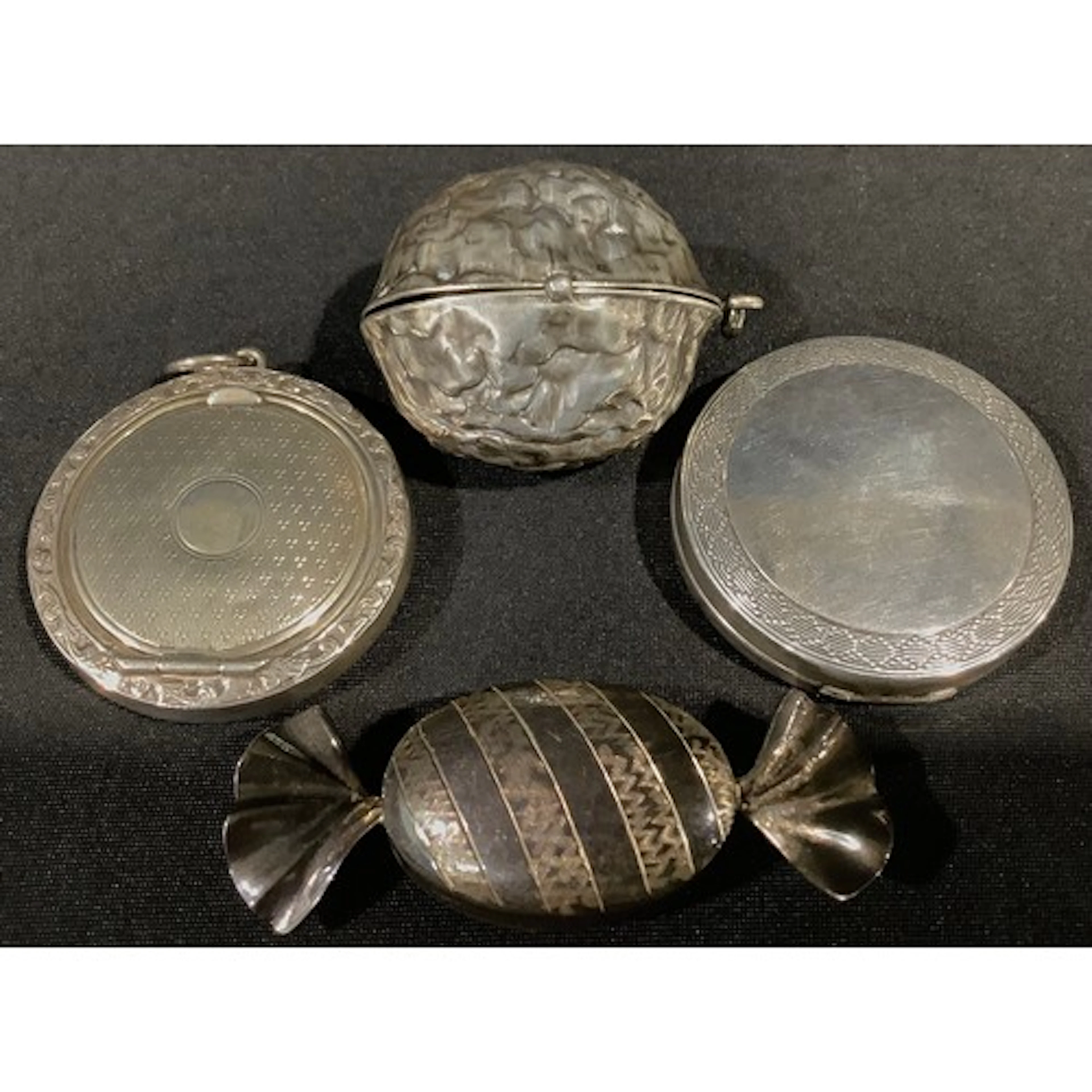Silver - a unusual silver walnut compact case, enclosed with...