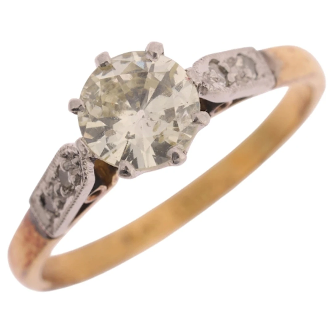 An 18ct gold 0.65ct single stone diamond ring, platinum-topp...