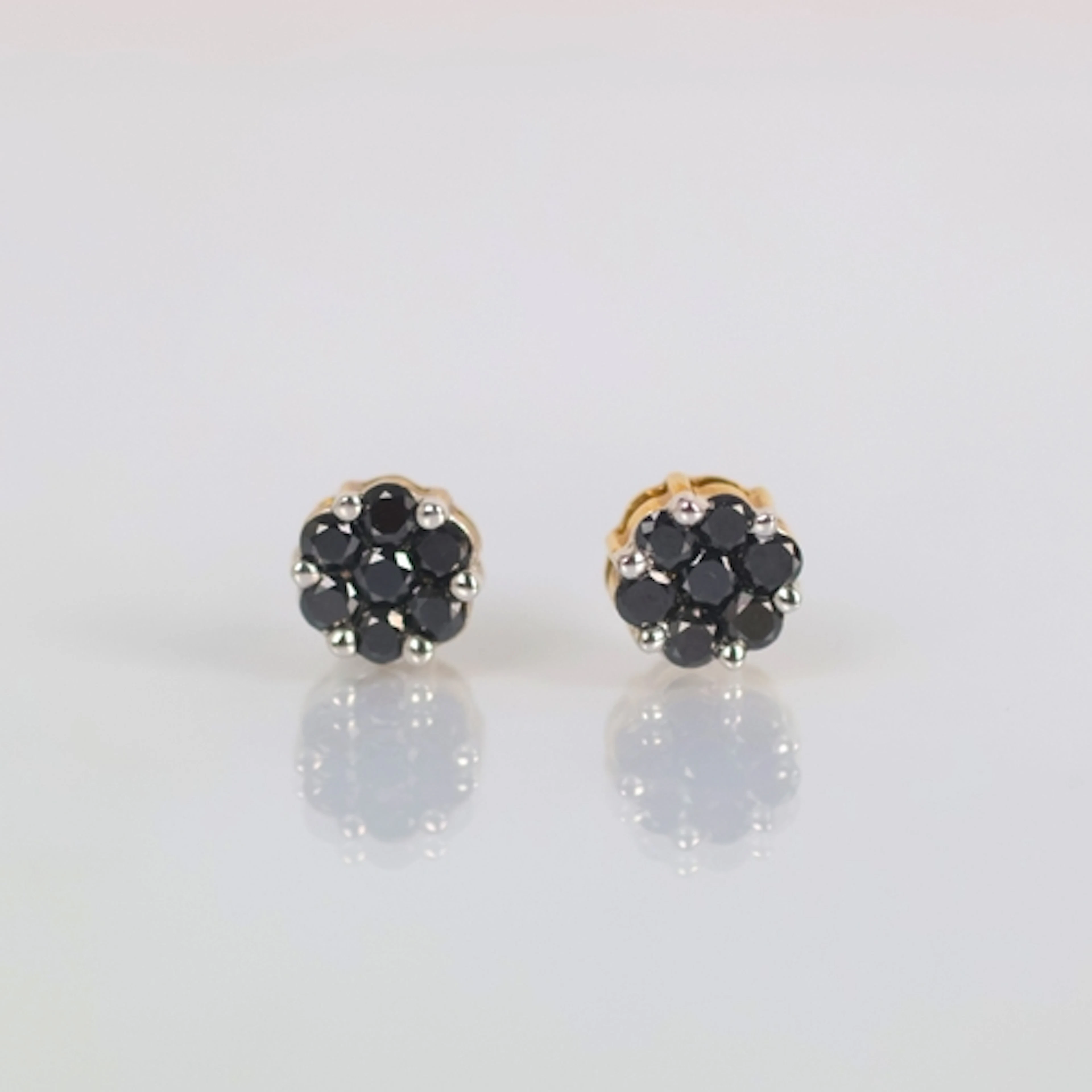 A pair of contemporary black diamond cluster earrings, of ty...