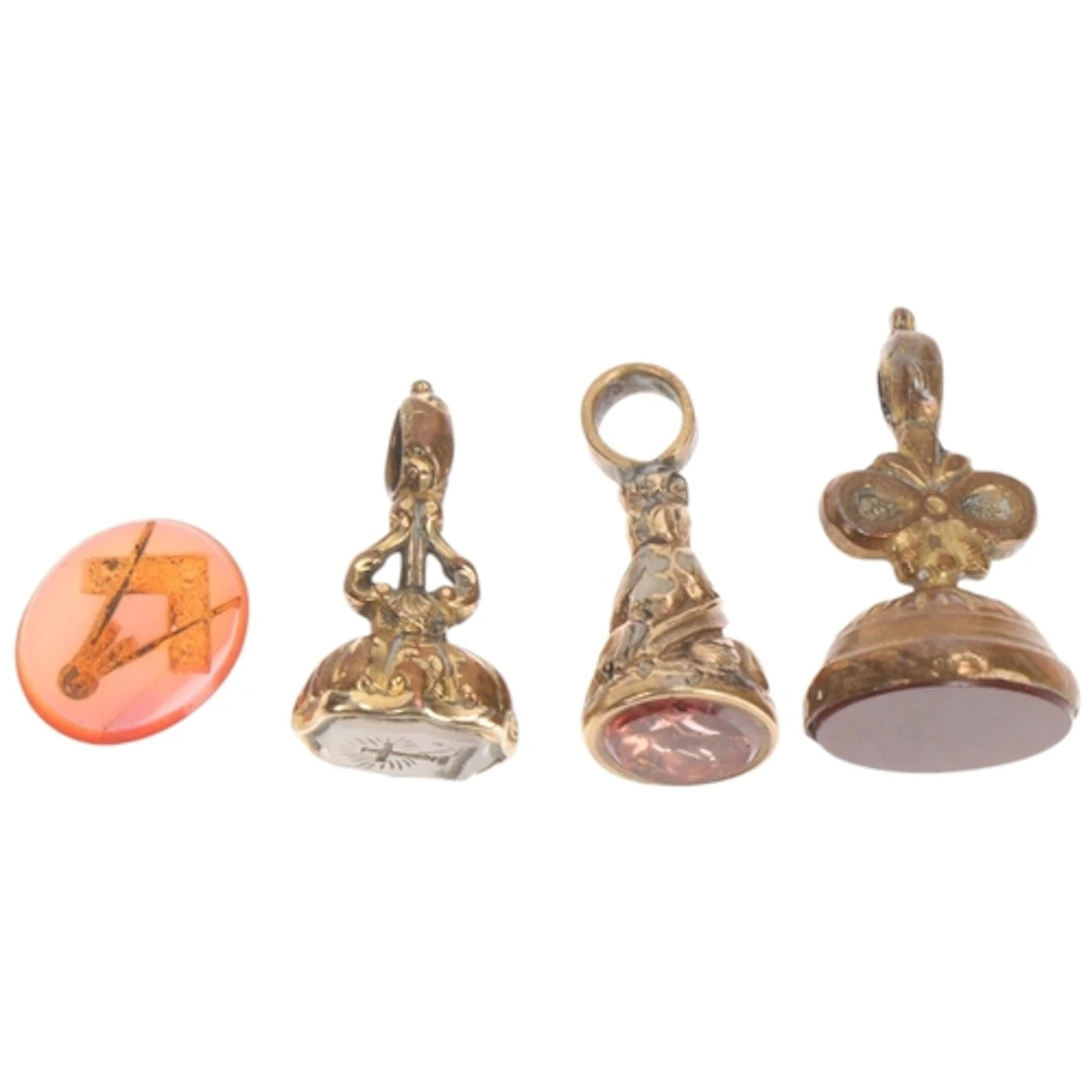 Various gilt-metal seal fobs, including Faith Hope And Chari...