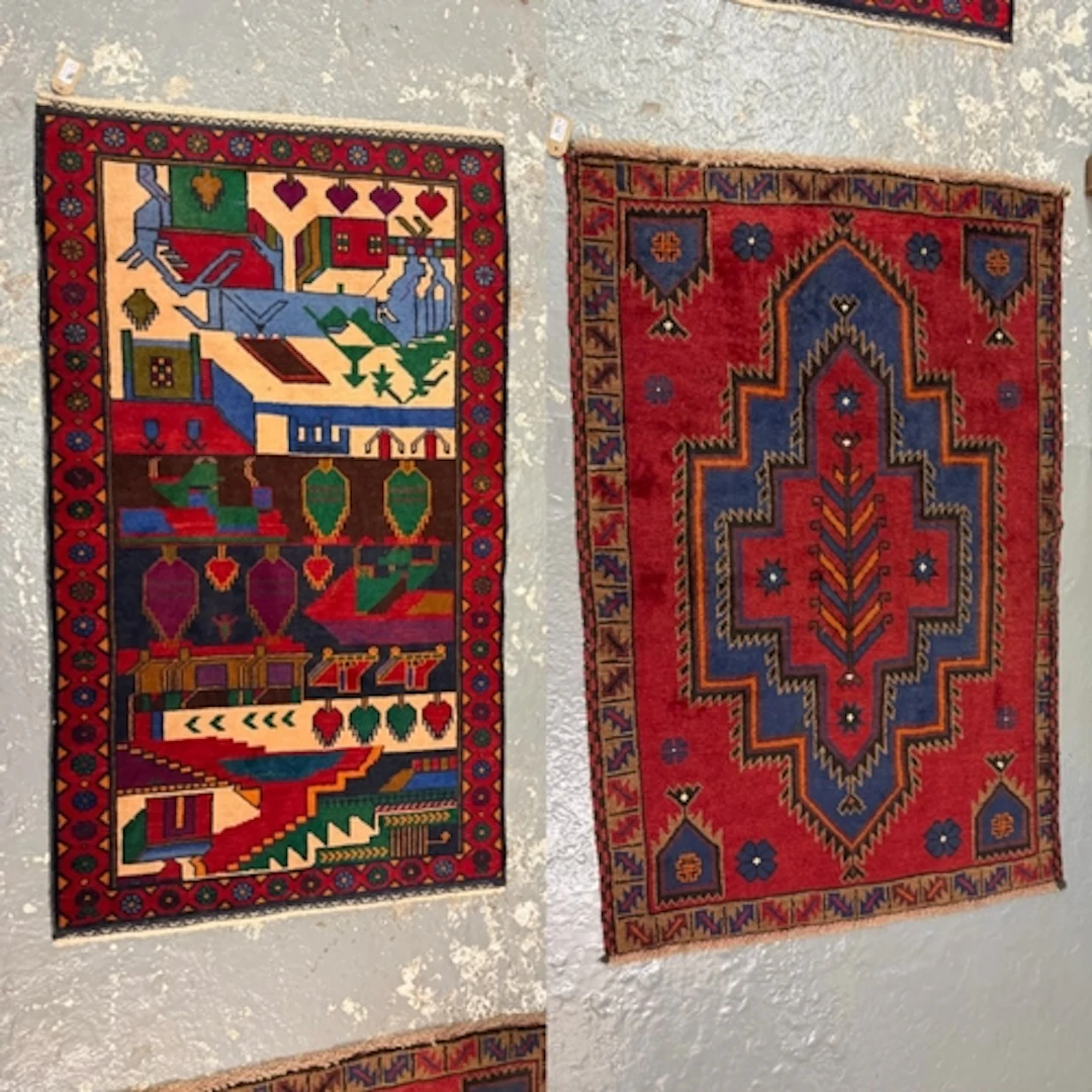 Vintage Afghan Hamadan or Baluchi rug on a deep red ground w...