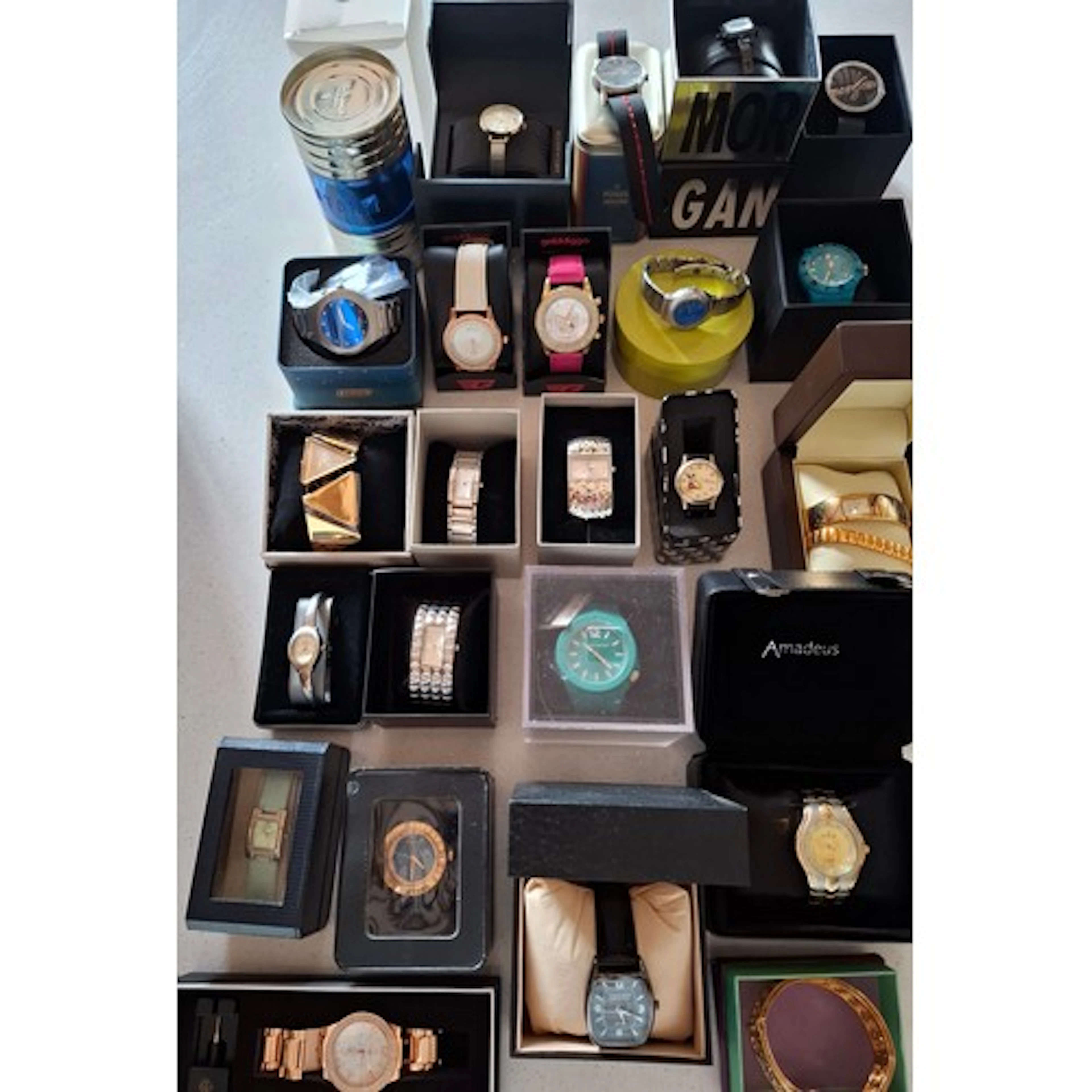 A collection of boxed fashion watches to include Fossil, Mor...