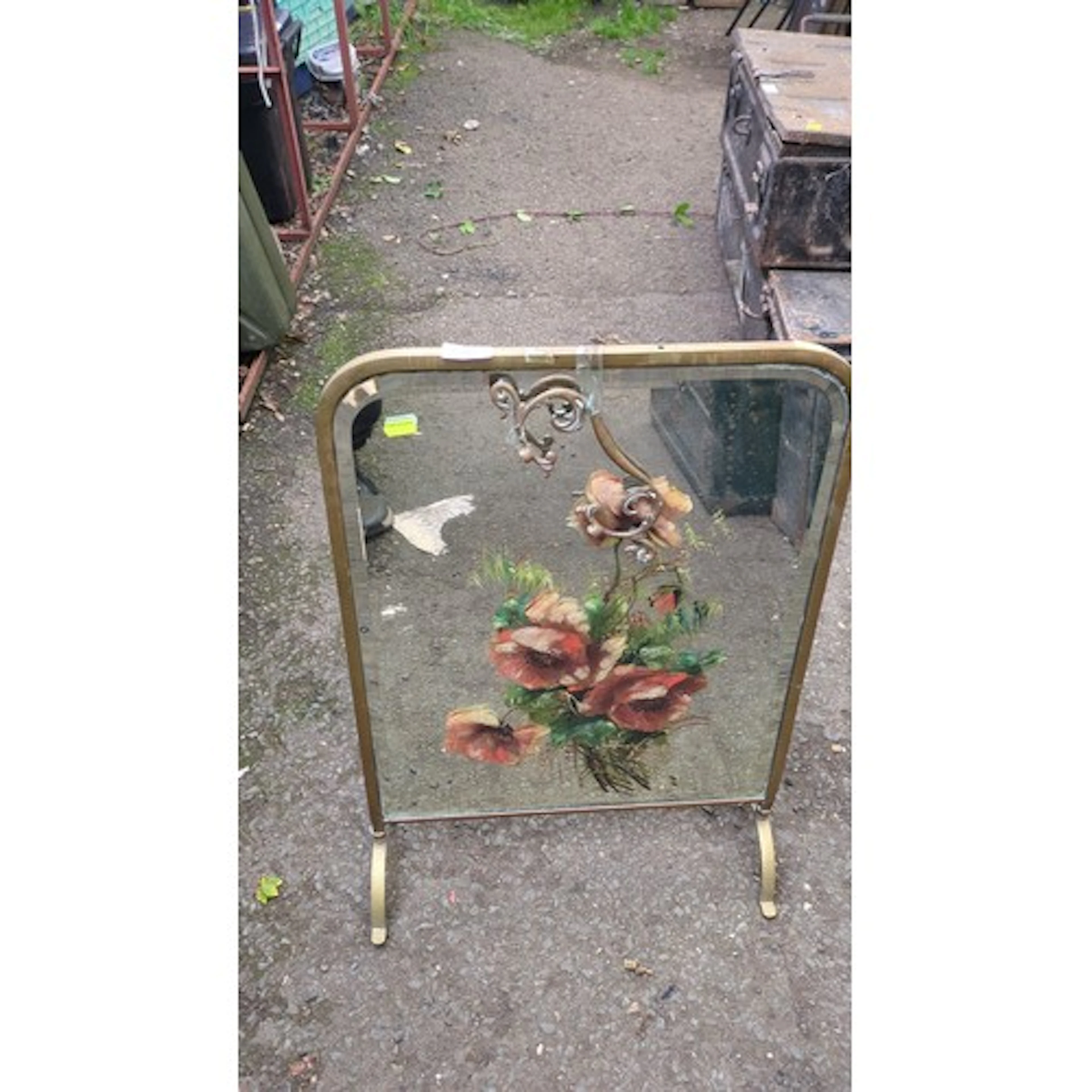 Mid-20th century brass-framed fire screen, the glazed panel ...