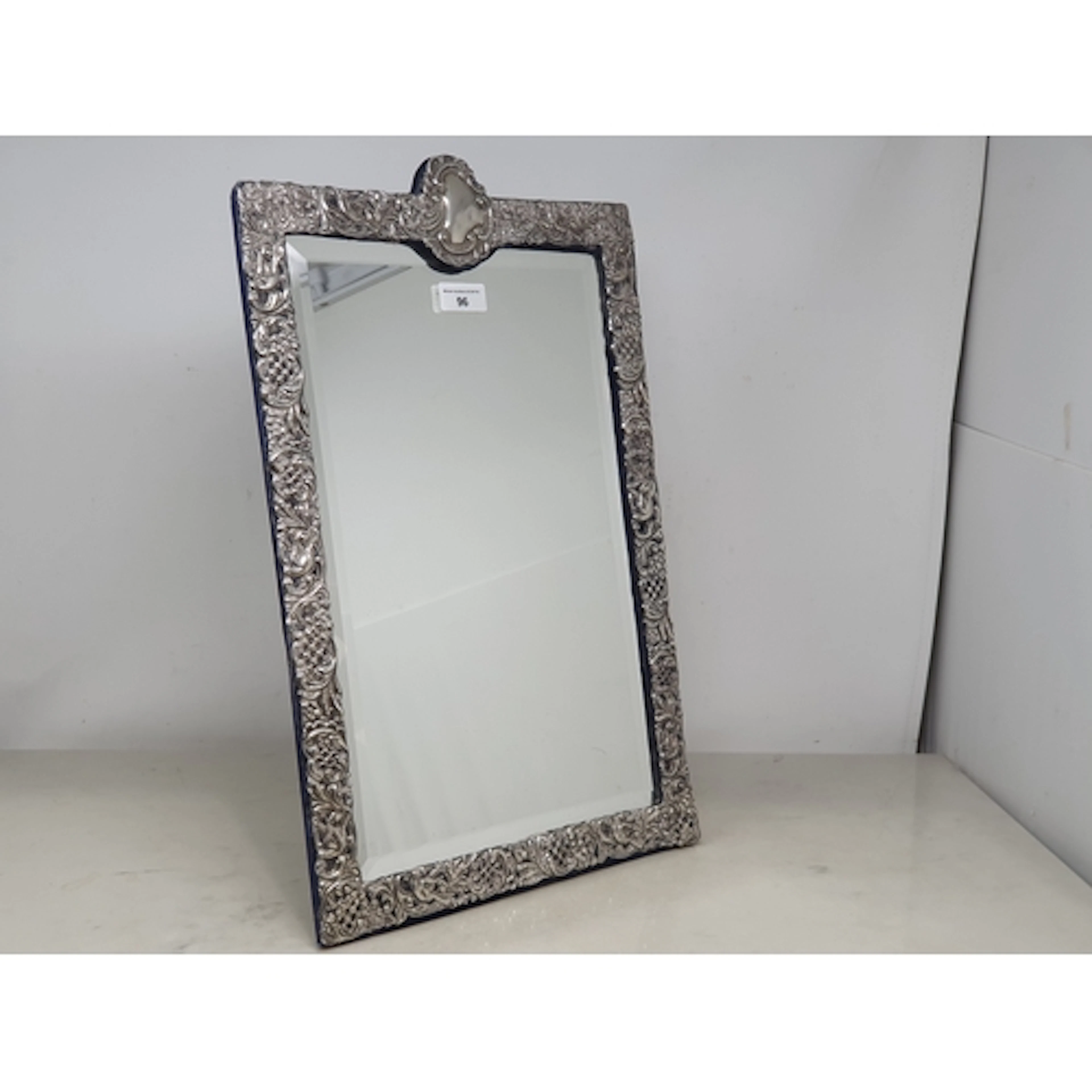An Edward VII silver framed Easel Mirror with bird, floral a...