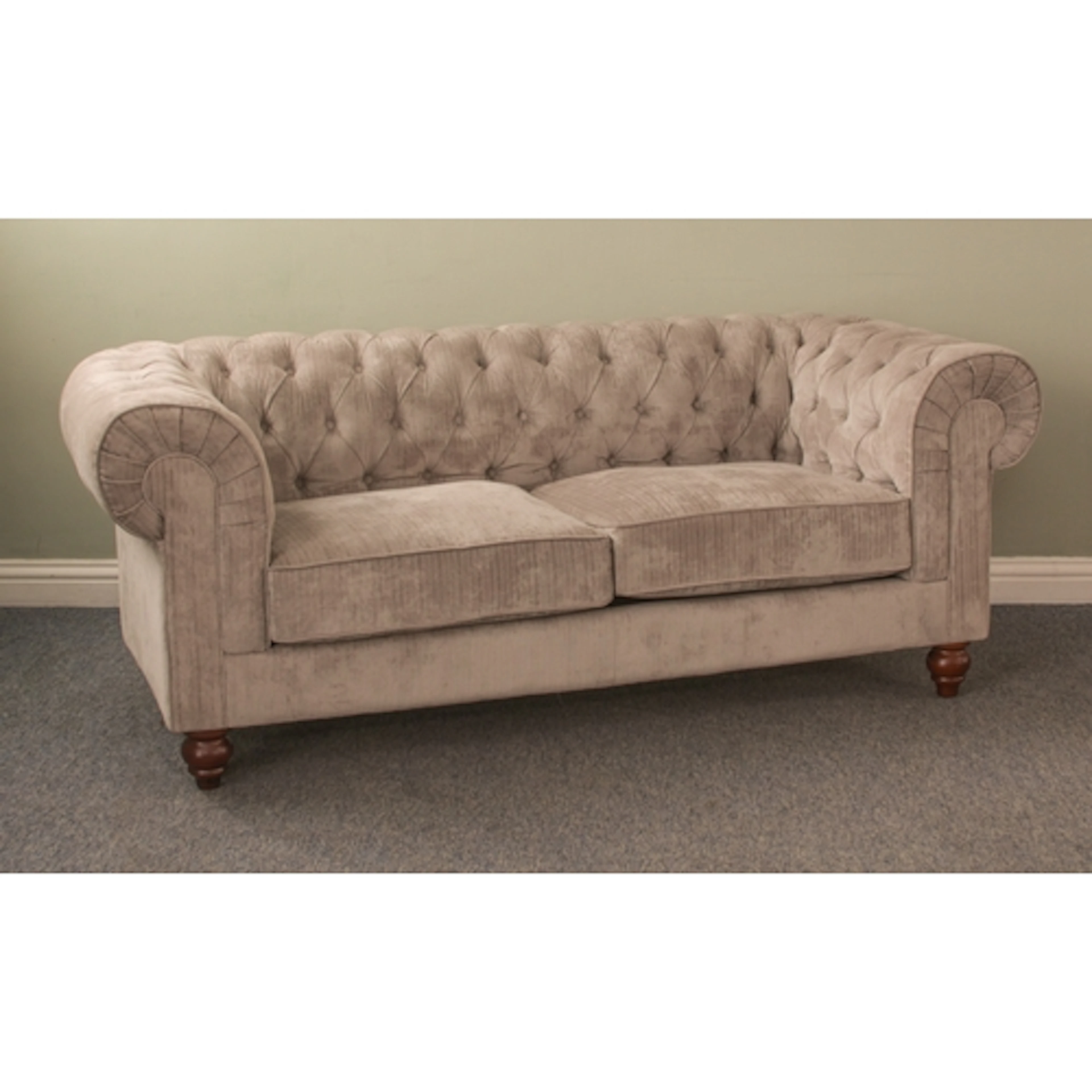 A modern Chesterfield-style sofa - upholstered in pale grey,...