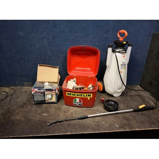 A MOTORCYCLE TOP BOX CONTAINING TOOL, a portable sprayer and...