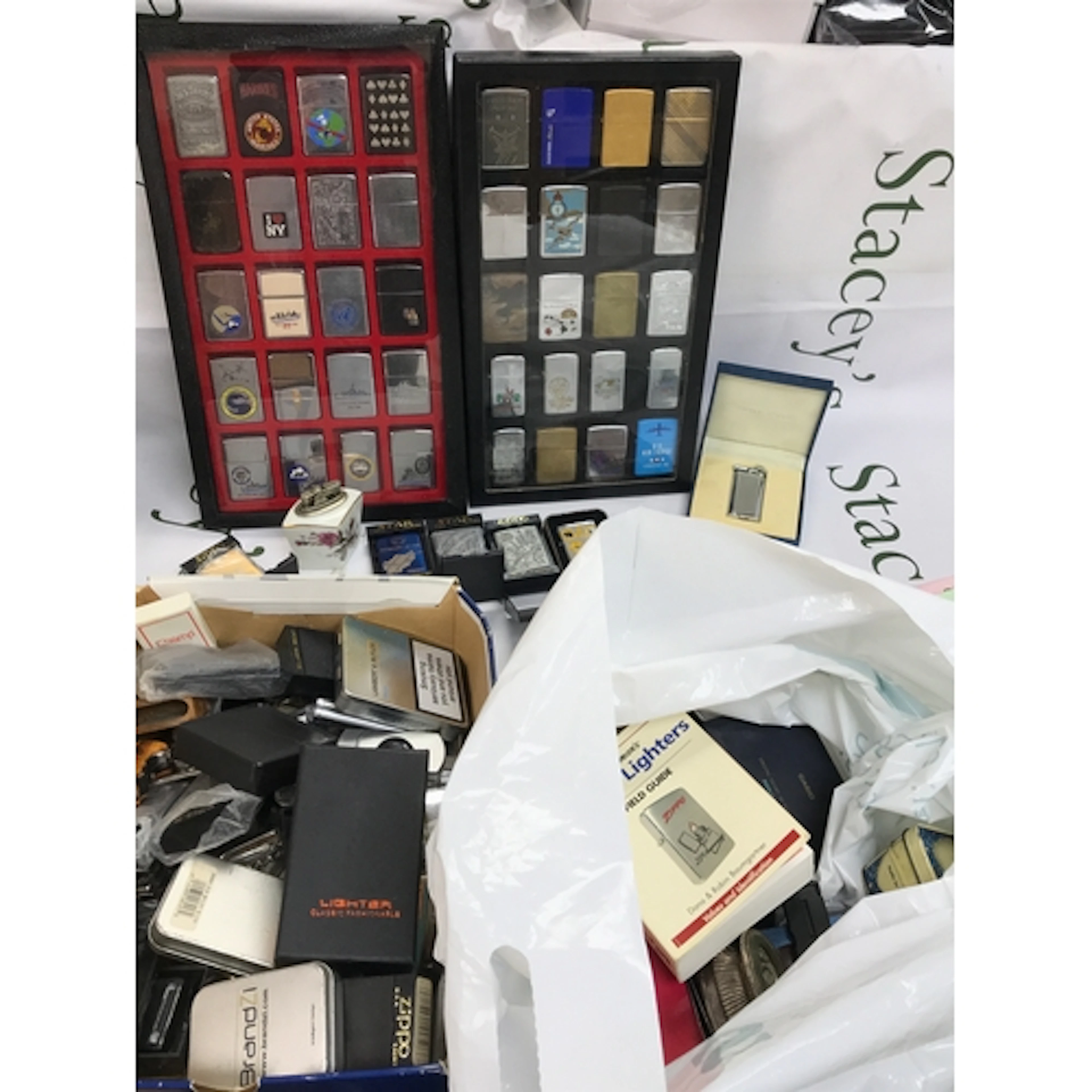 A large collection of vintage lighters including Zippo, Star...