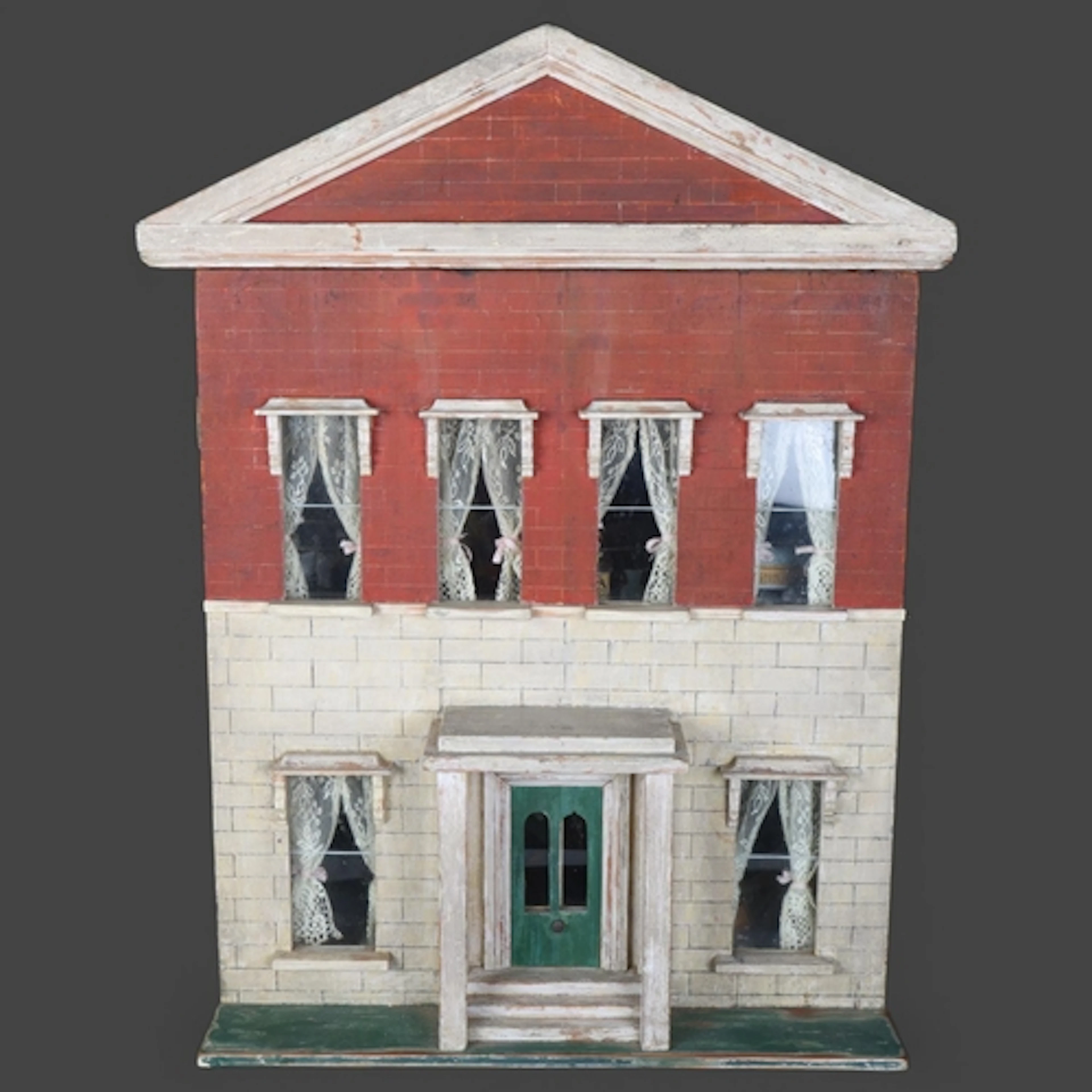 An early 20th century fully furnished doll's house, the fron...
