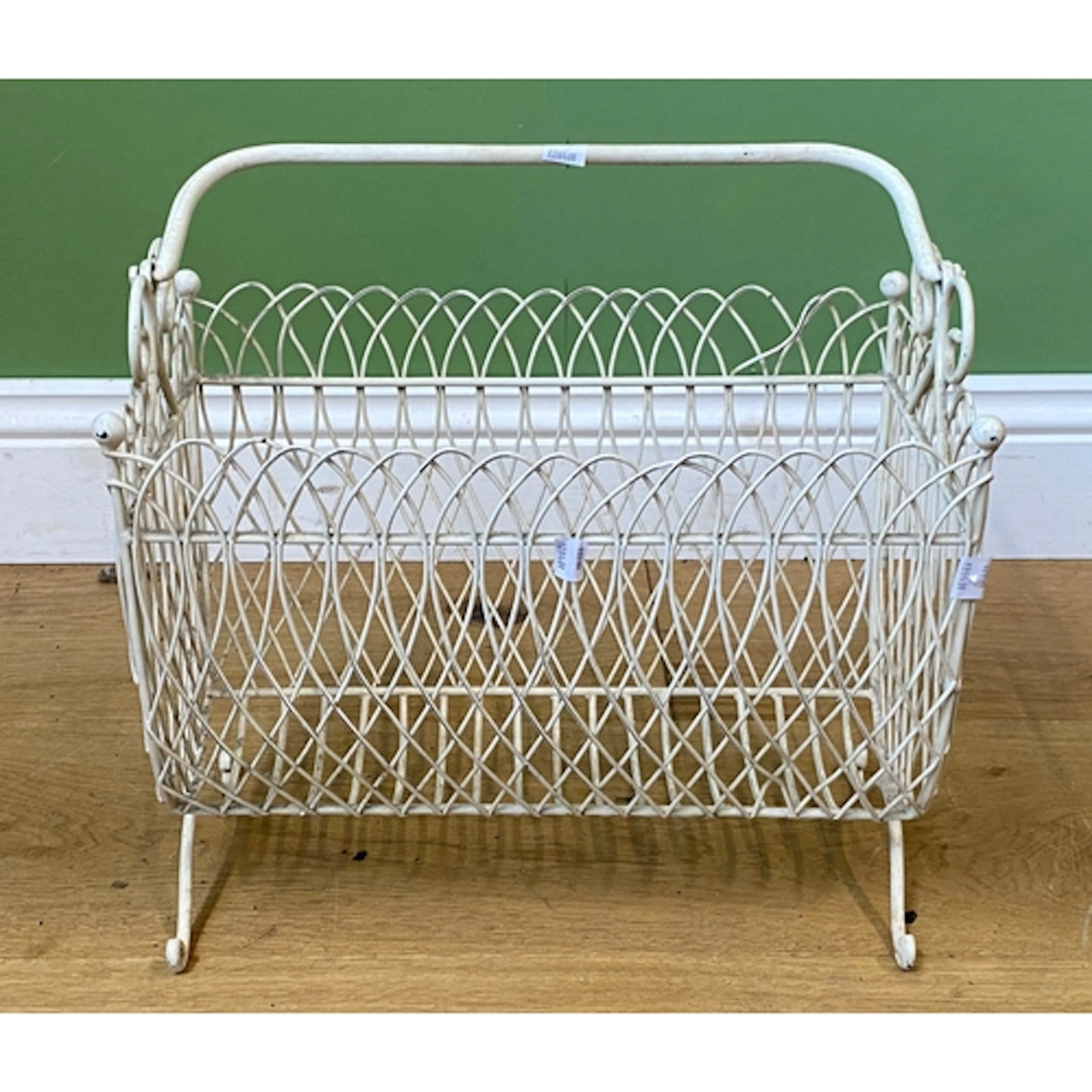 A white painted wire work magazine rack, 41cmW