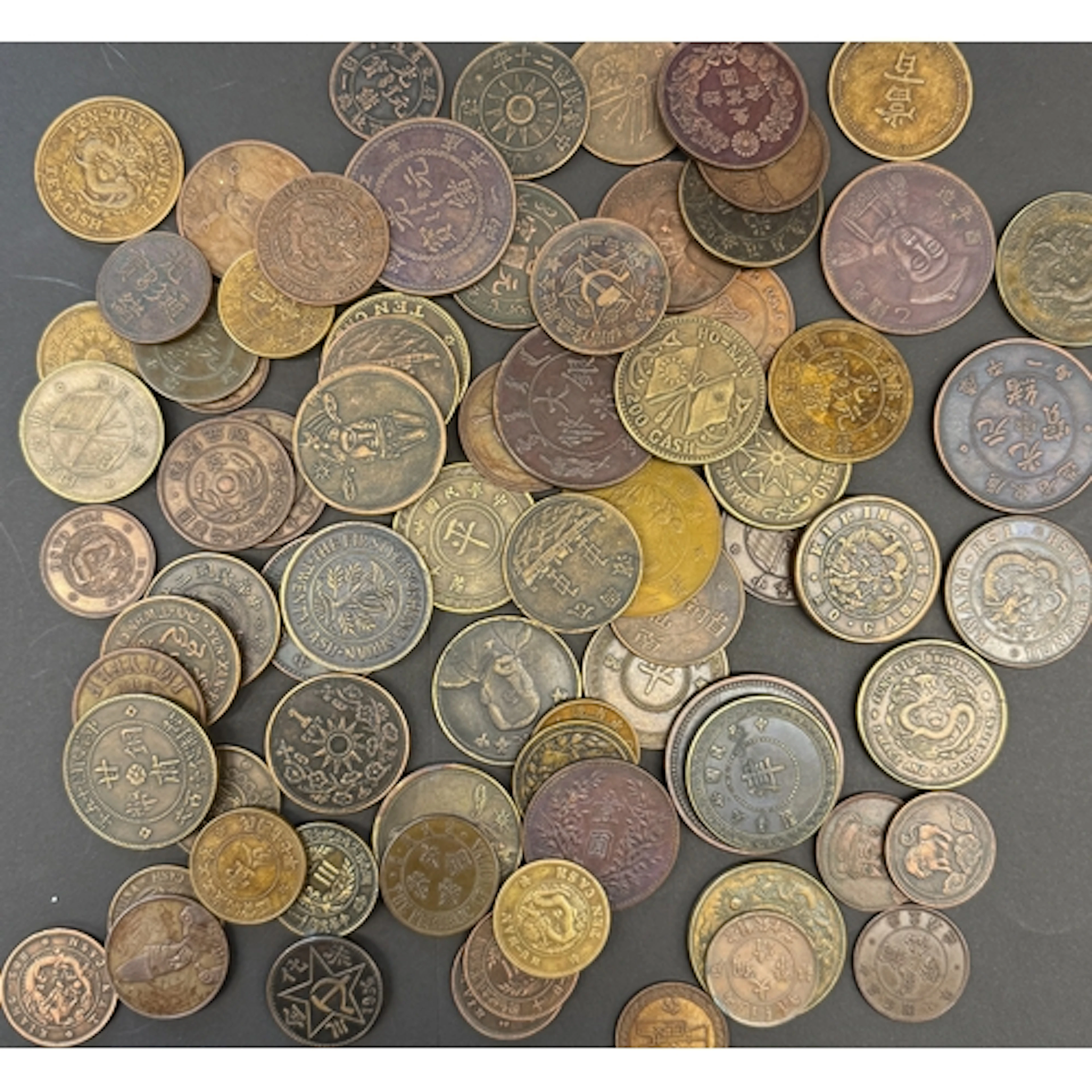 A collection of 76 Chinese copper and brass coin reproductio...
