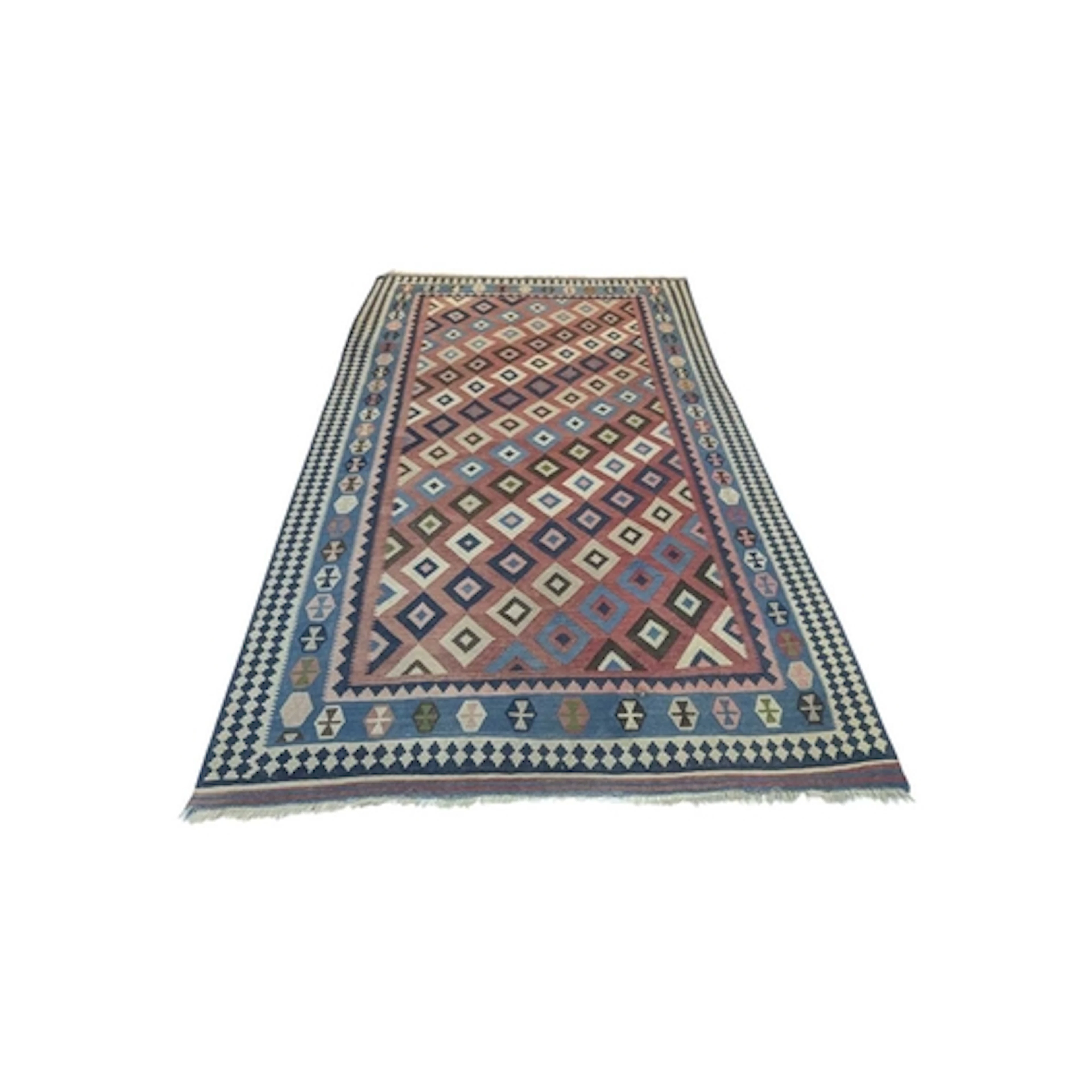 A 20th century Turkish kilim wool rug carpet. The rig having...