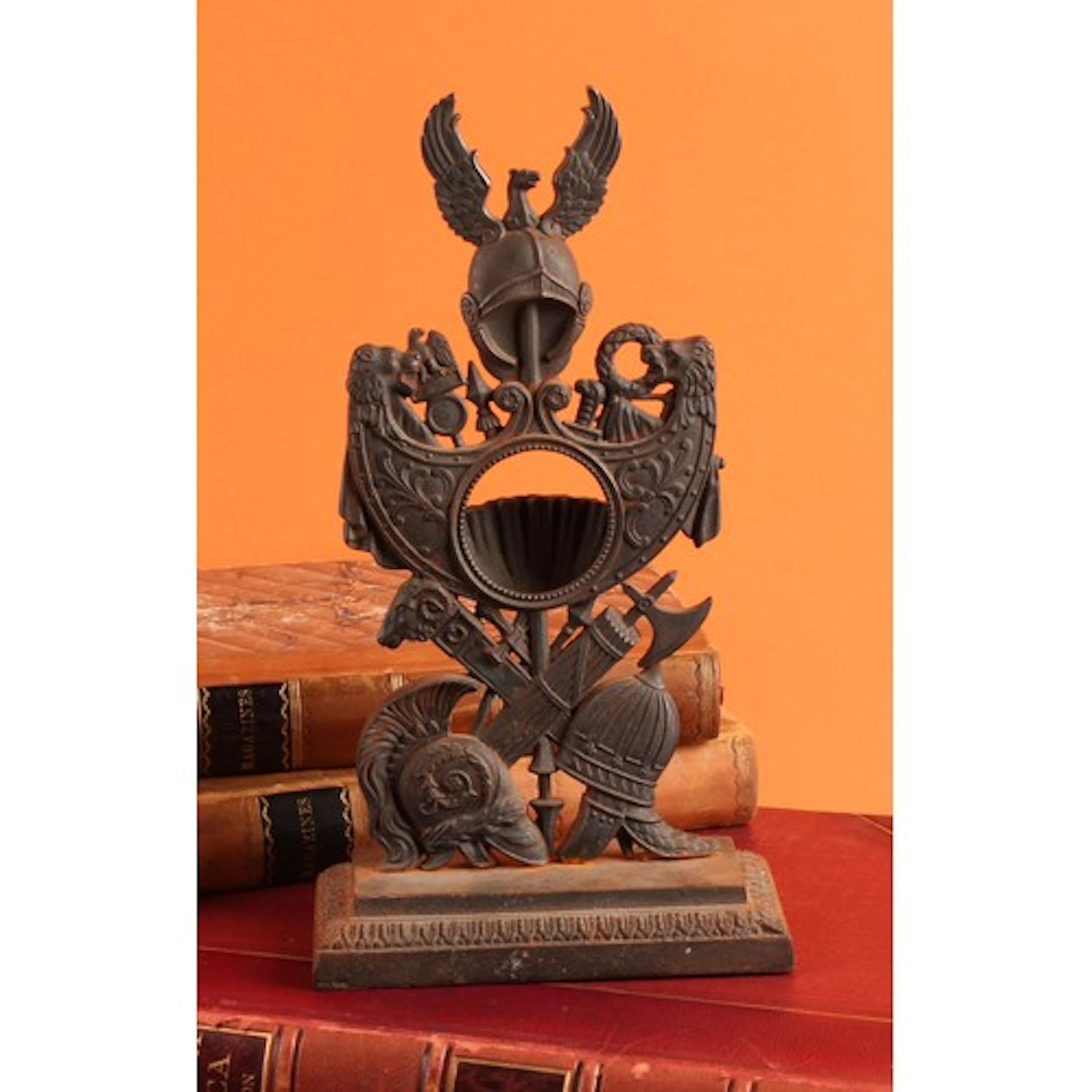 A 19th century cast iron pocket watch stand, with Greco-Roma...