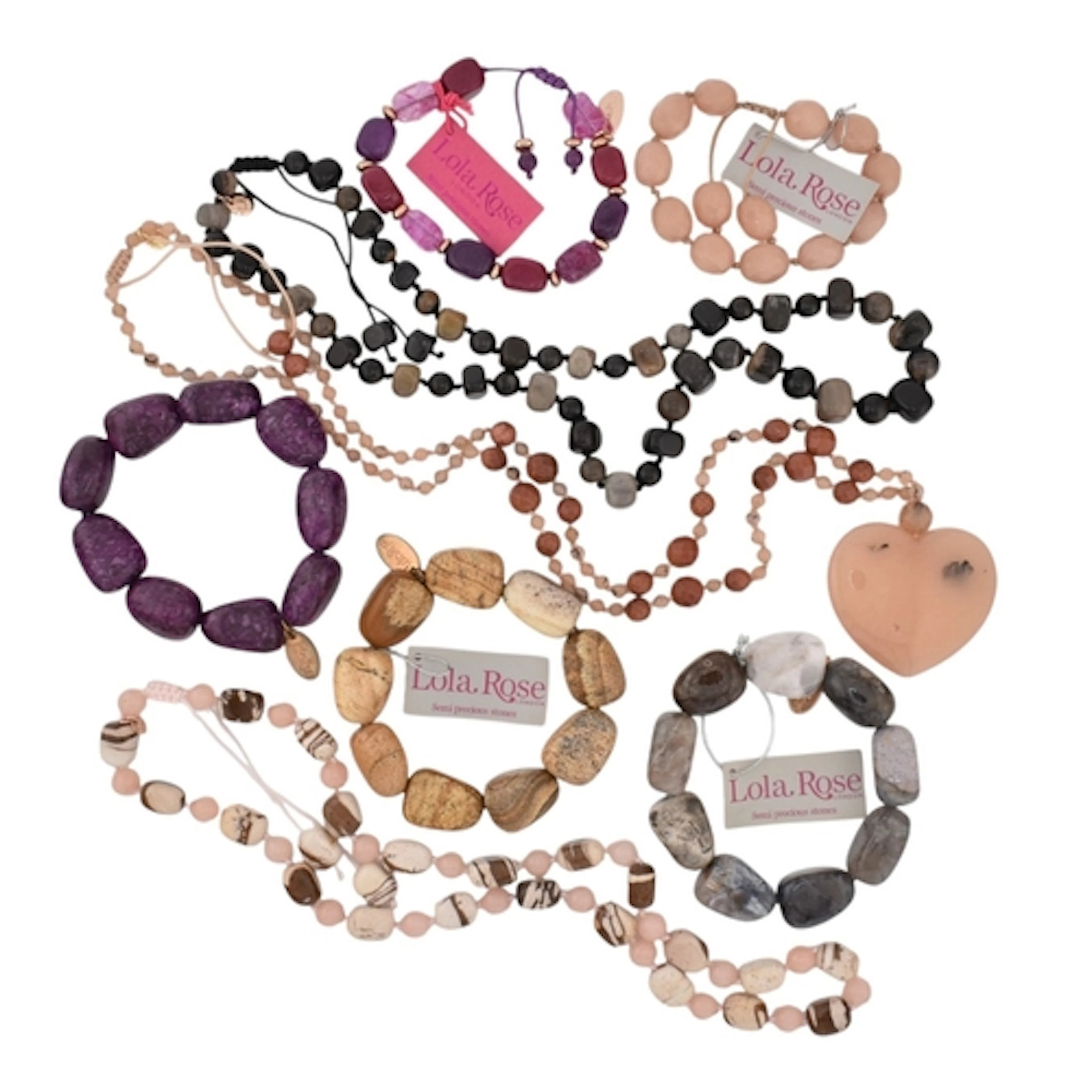 A selection of purple, pink, and brown Lola Rose jewellery. ...