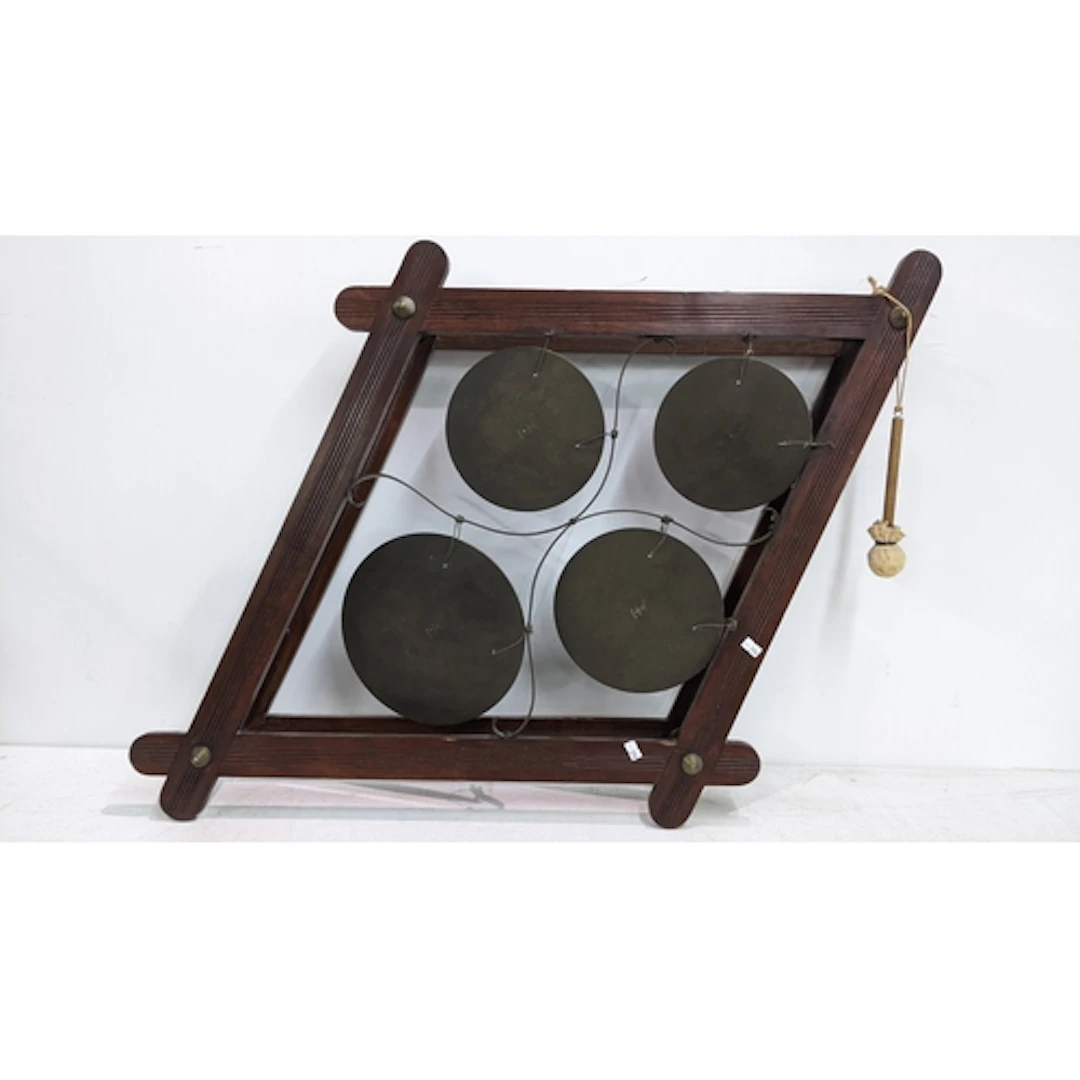 A circa 1900 mahogany wall hanging dinner gong, having four ...