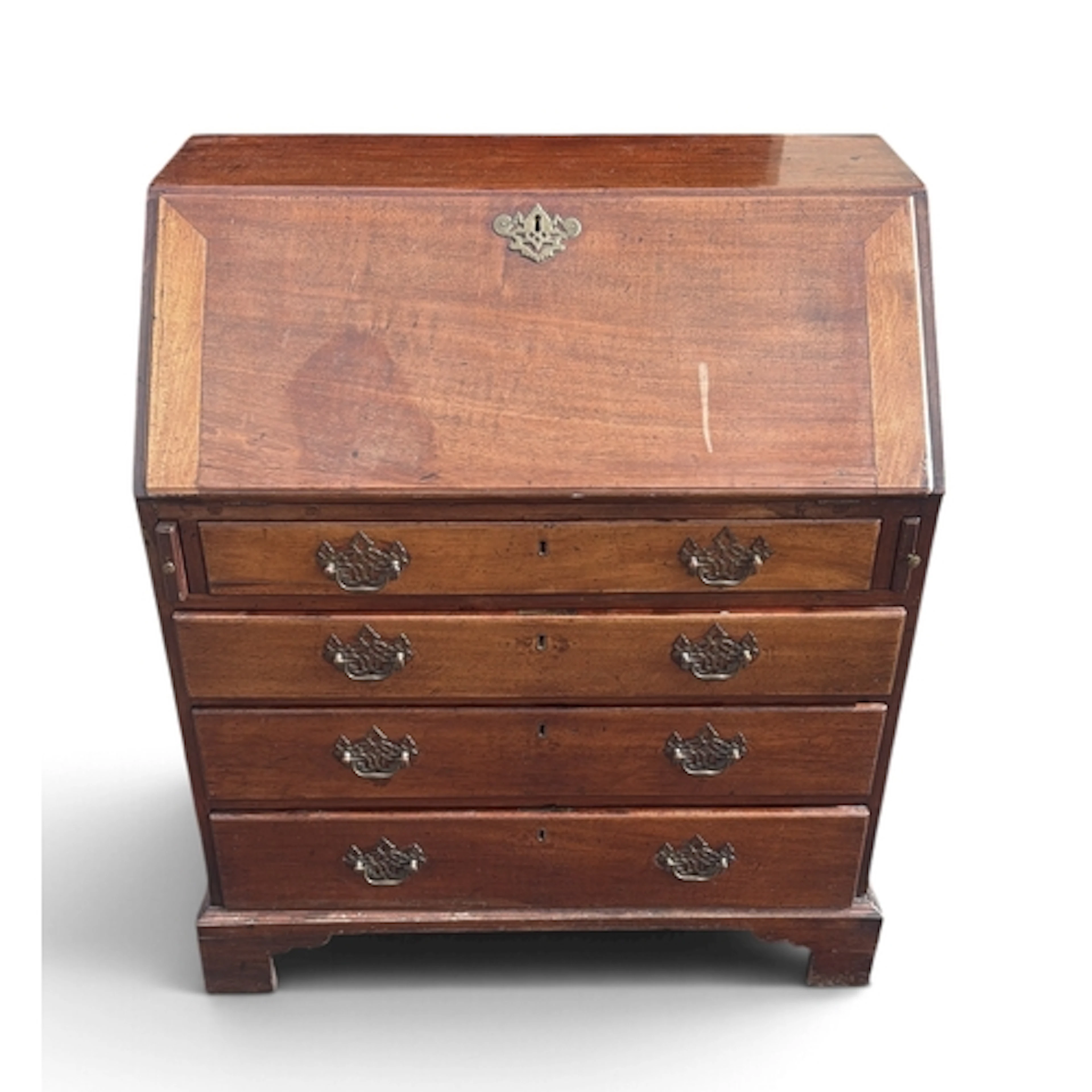 A GEORGE III STYLE MAHOGANY BUREAU, 19TH CENTURY With four l...
