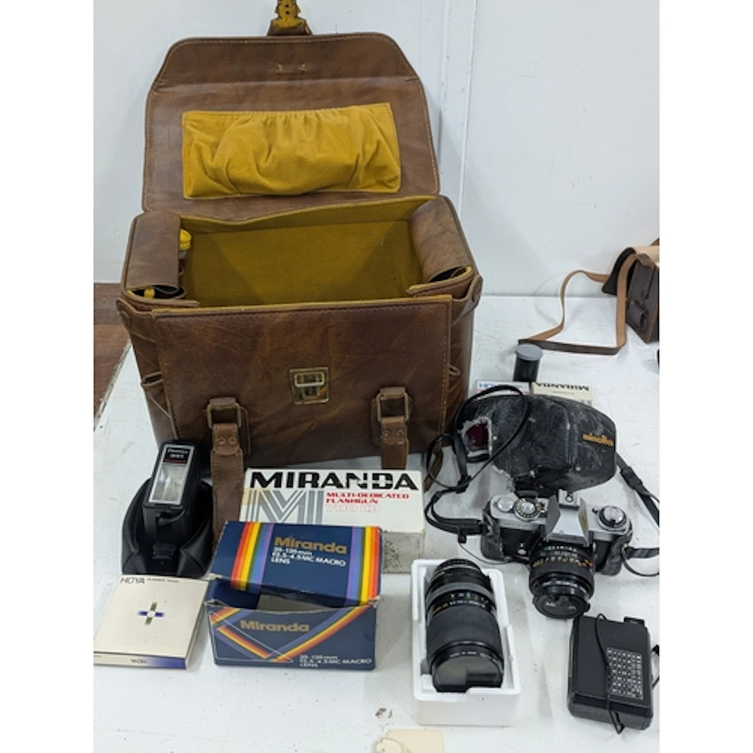 A vintage Minolta XD7 camera, together with a Minolta 35-135...