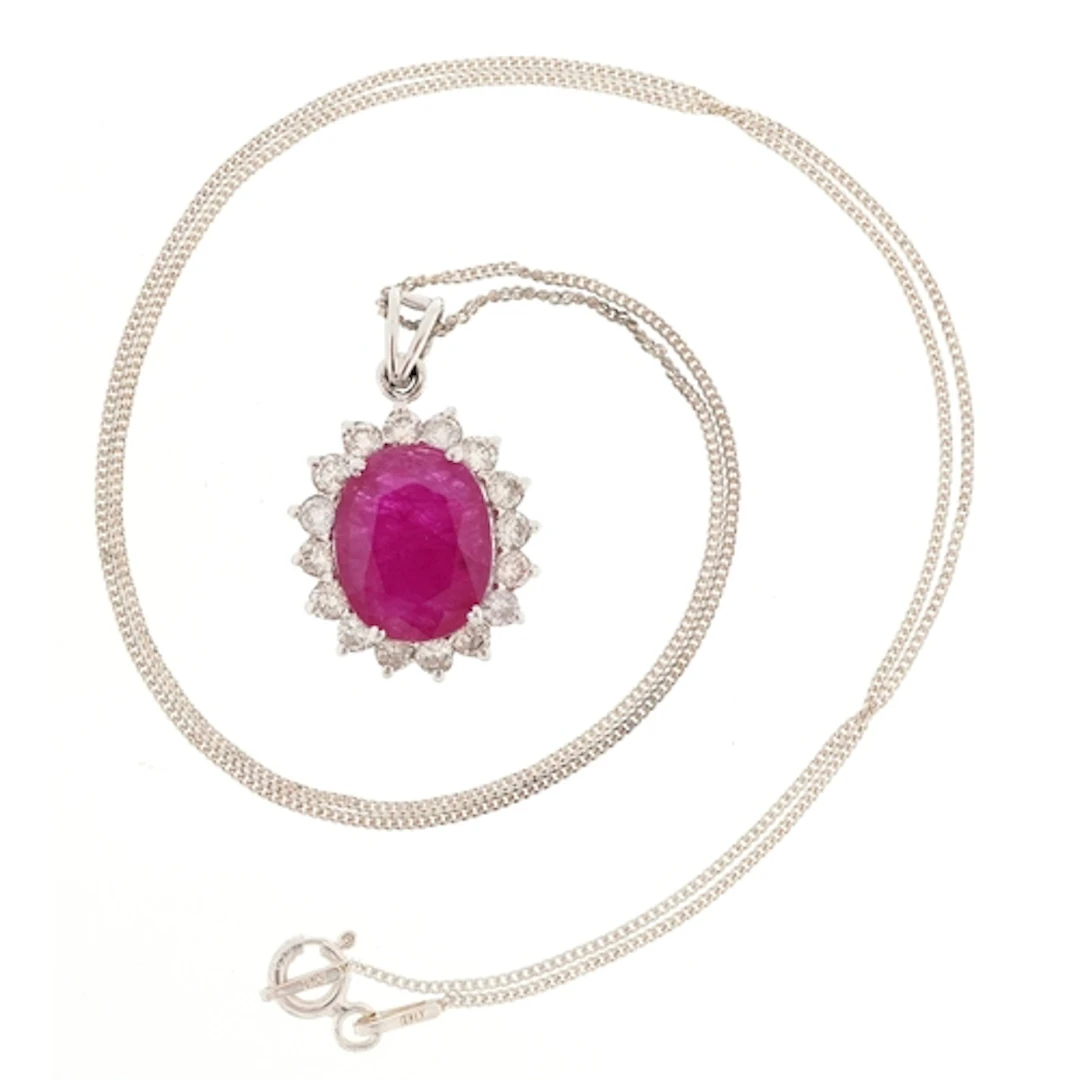 18ct white gold oval ruby and diamond cluster pendant on a s...