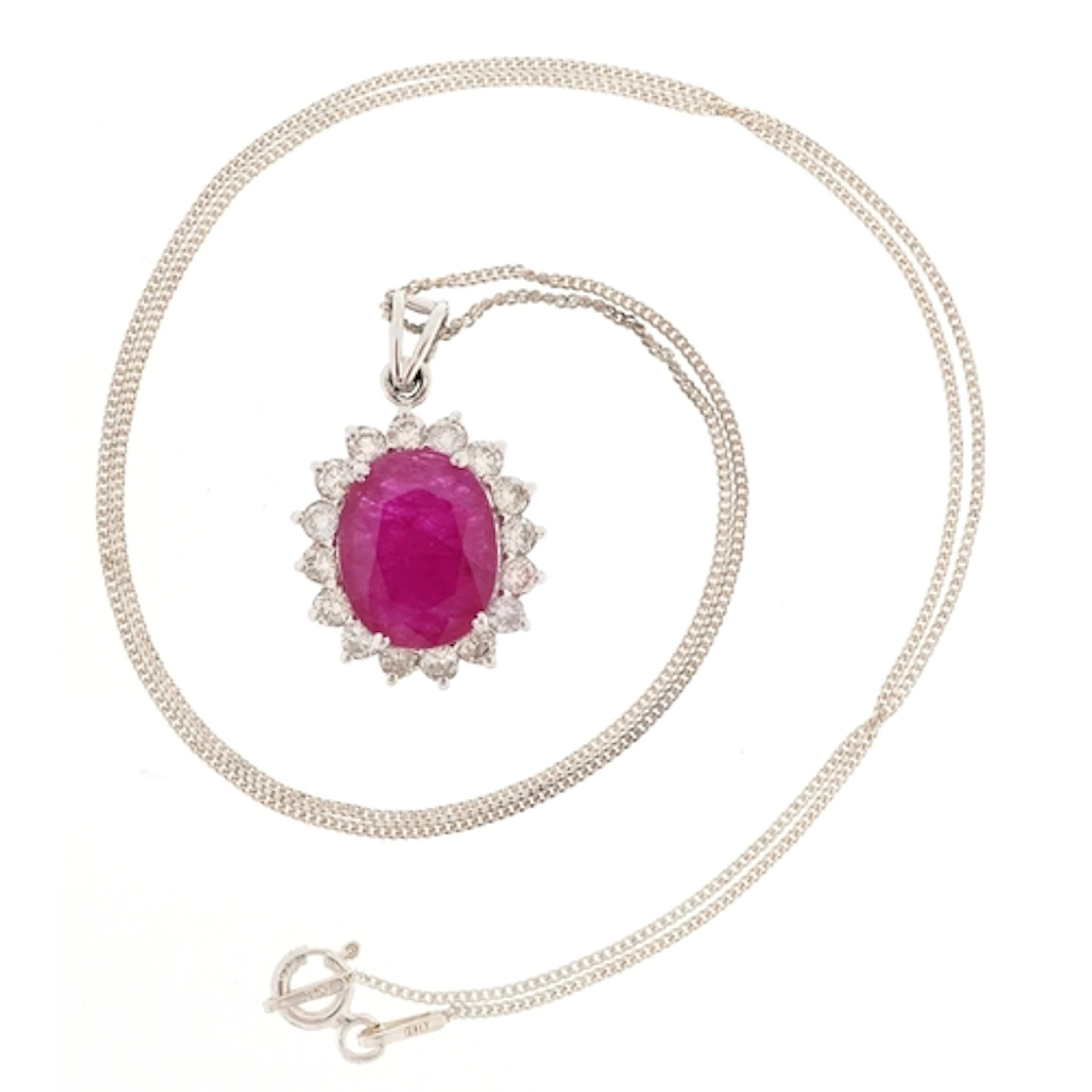 18ct white gold oval ruby and diamond cluster pendant on a s...