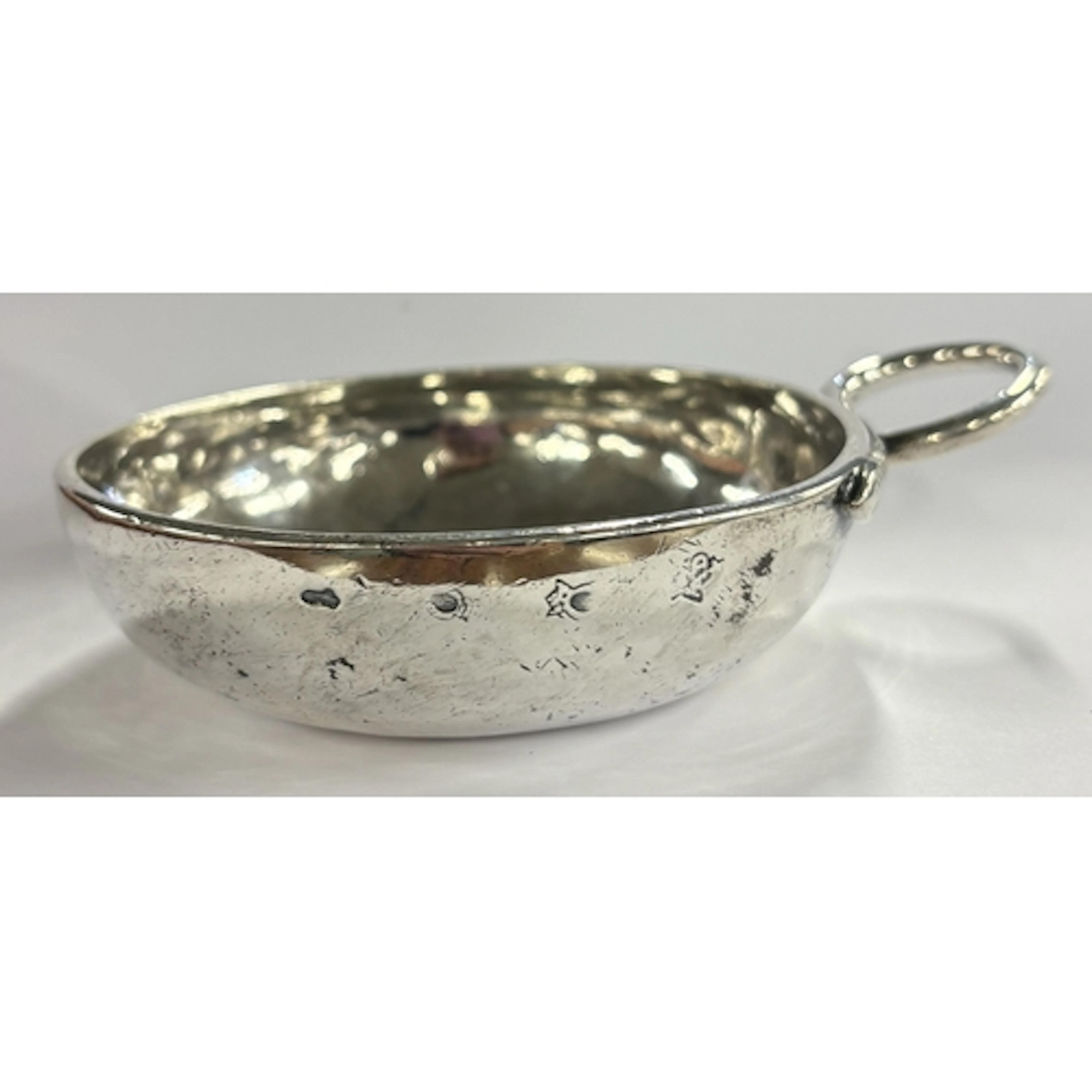 An 18th Century French silver wine taster, marked to side. A...