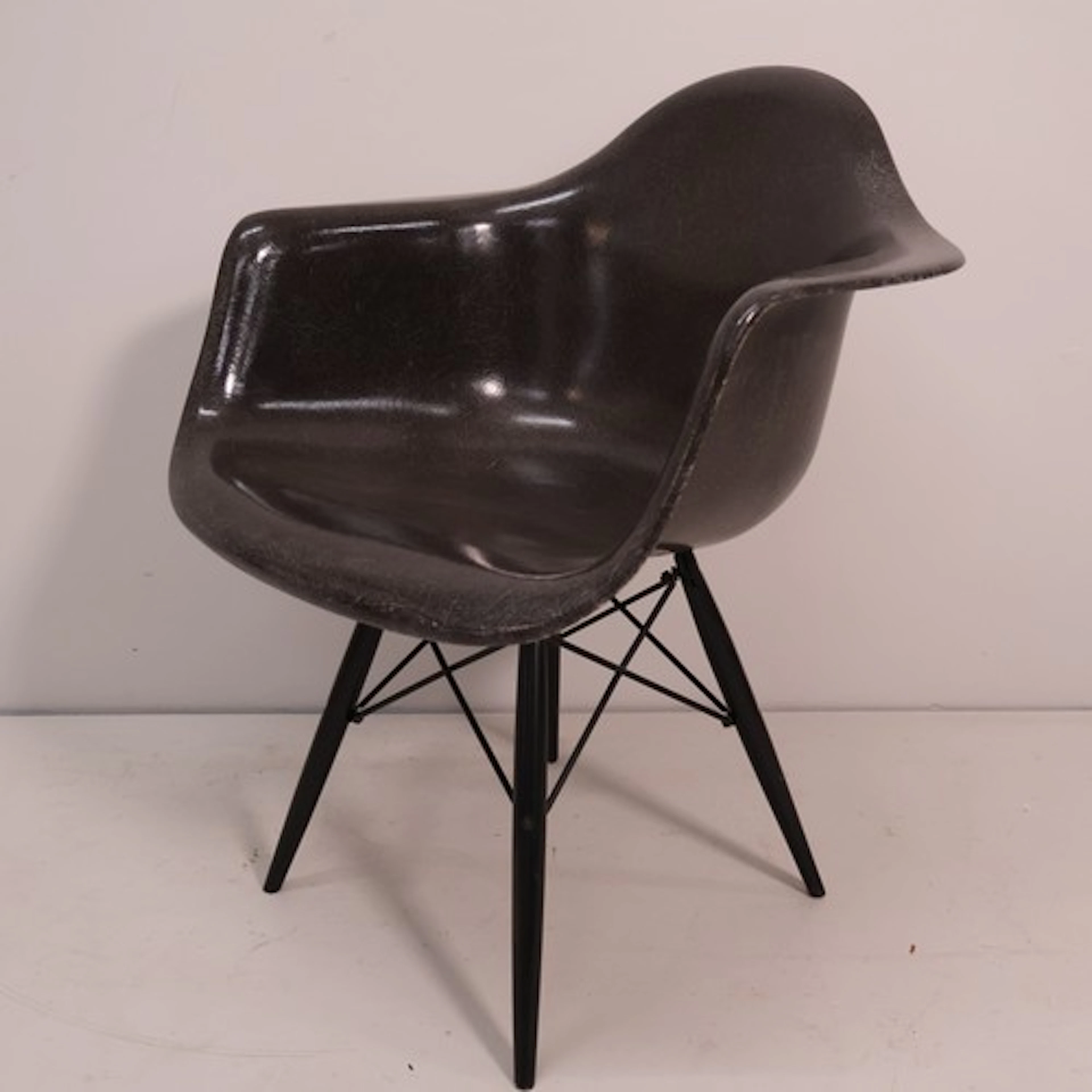 A Modernica Eames DAE Fibreglass armchair in elephant grey, ...