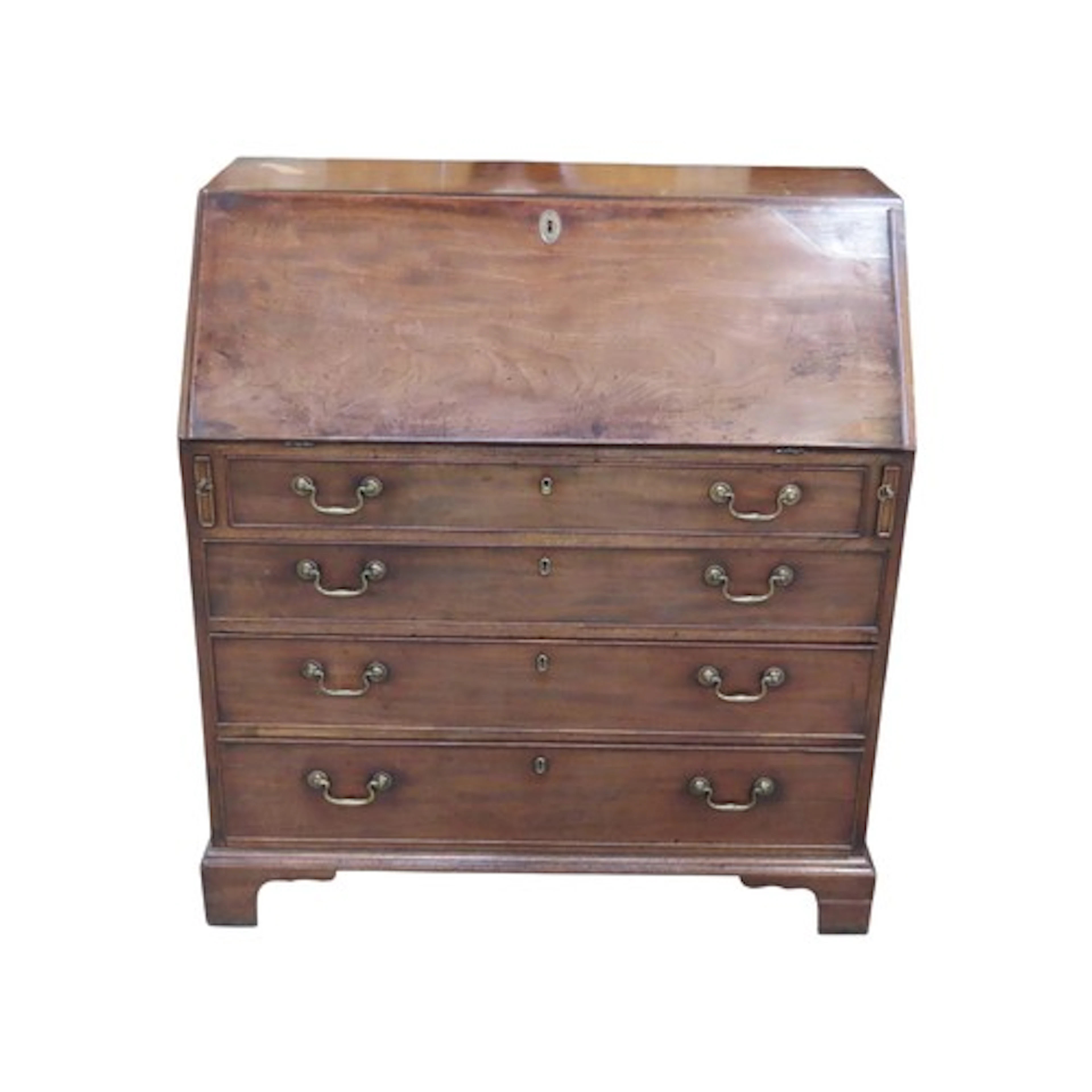 A Georgian mahogany bureau the fall flap enclosing a fitted ...