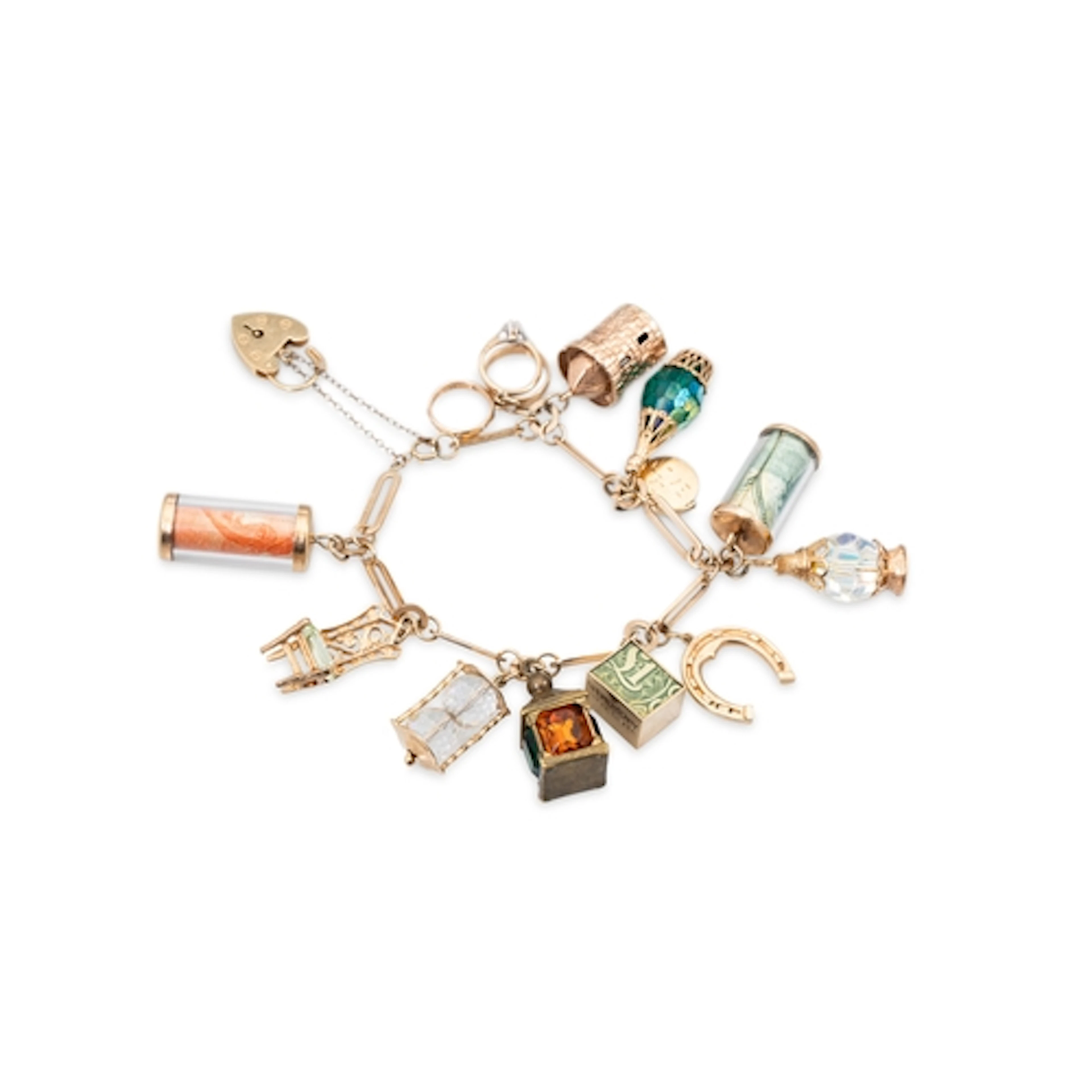 A 9CT YELLOW GOLD CHARM BRACELET, gw 63.2 g....