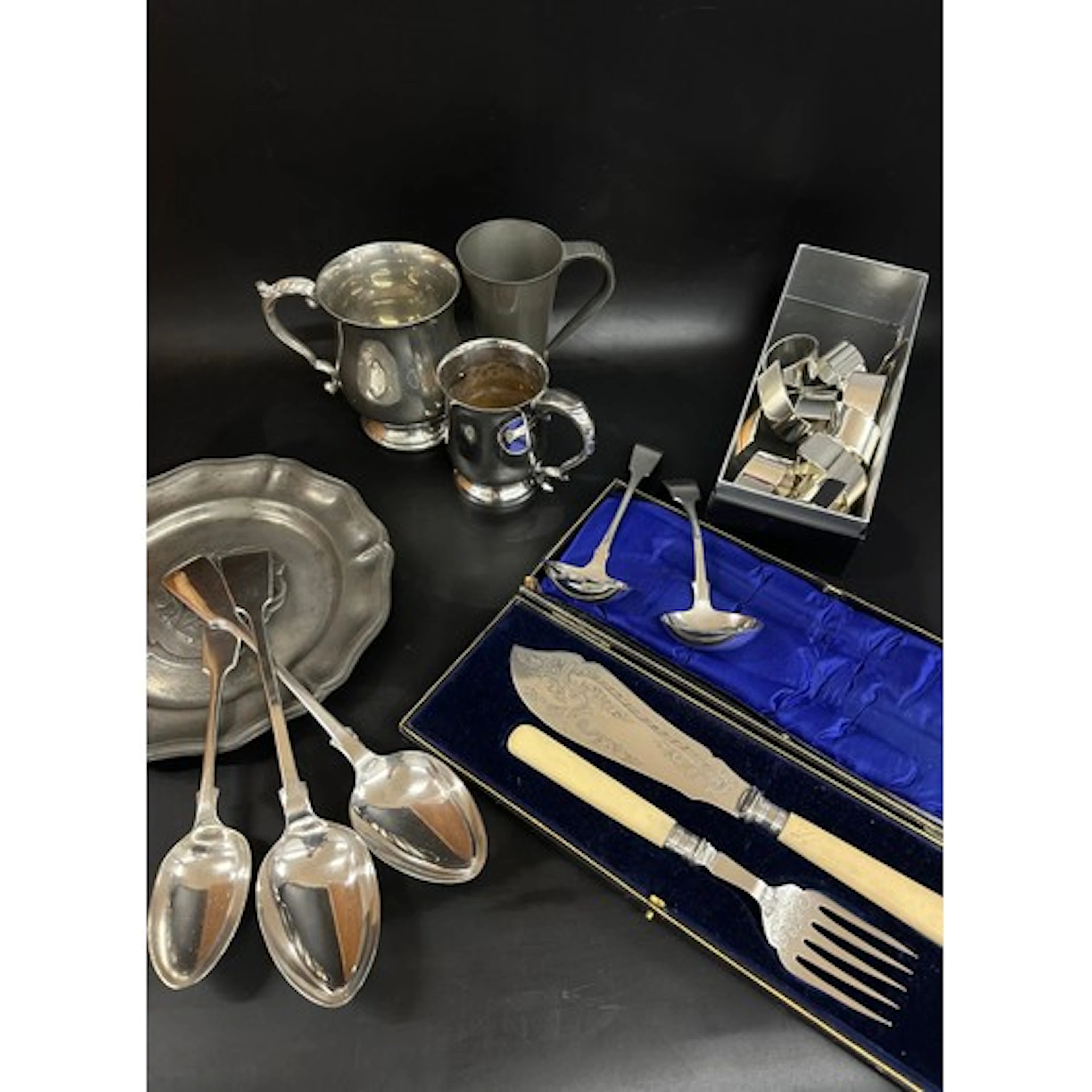 Two large plated serving spoons, a table spoon, three ladles...