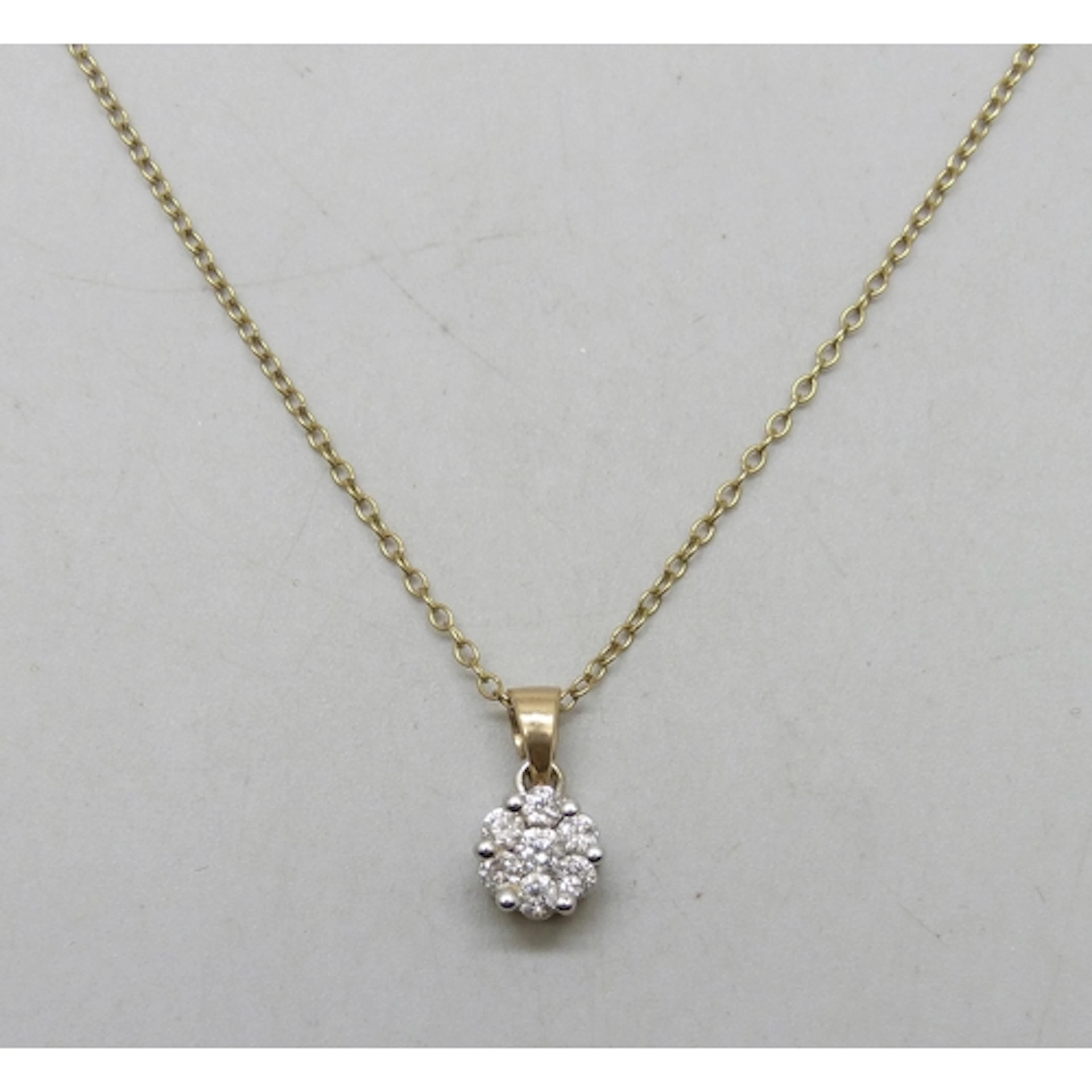 A 9ct gold diamond cluster pendant, .50ct total diamond weig...