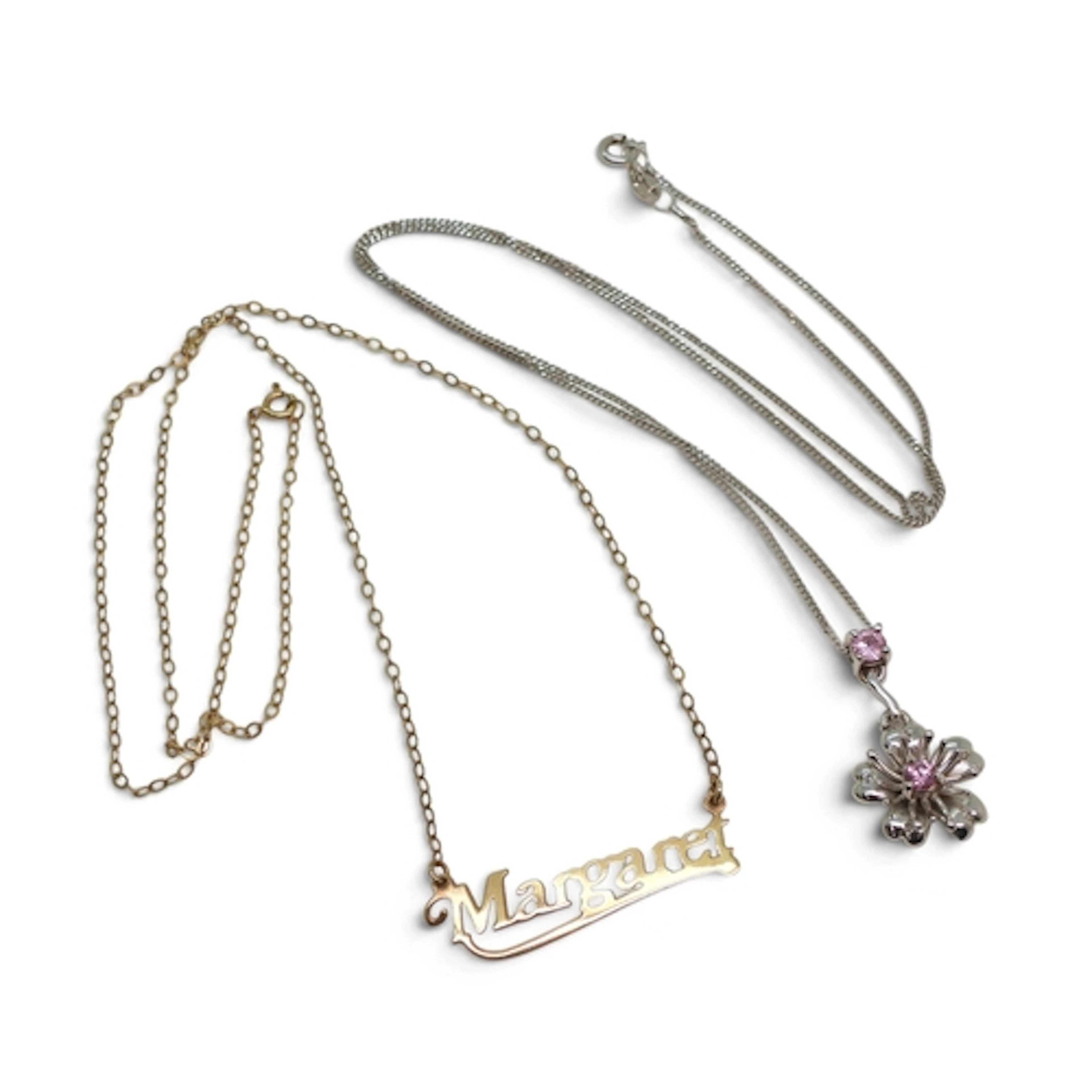A 9ct white gold pink sapphire and diamond accent set flower...