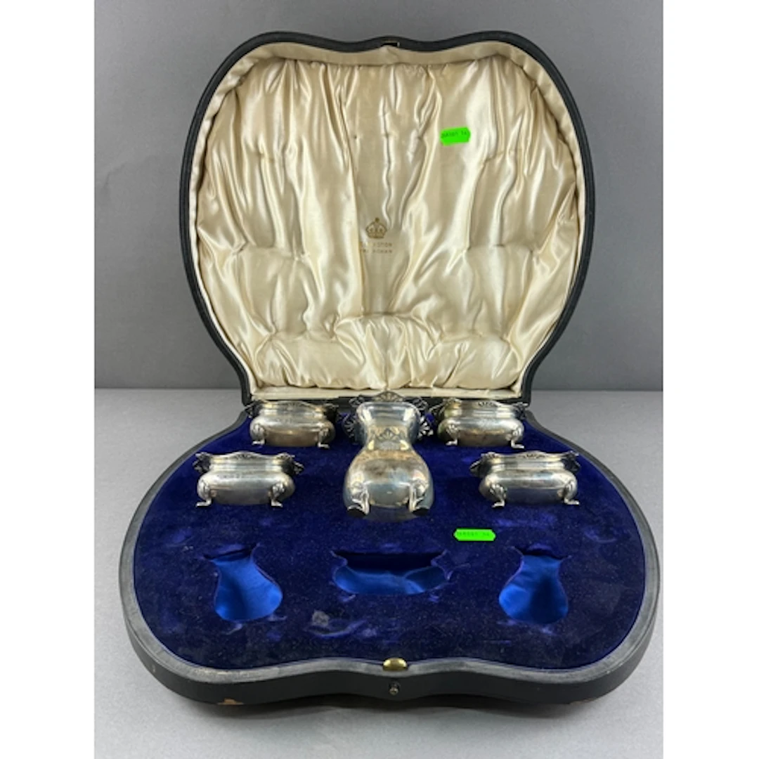 Silver: a part cruet set by Elkington, Birmingham 1911, cons...