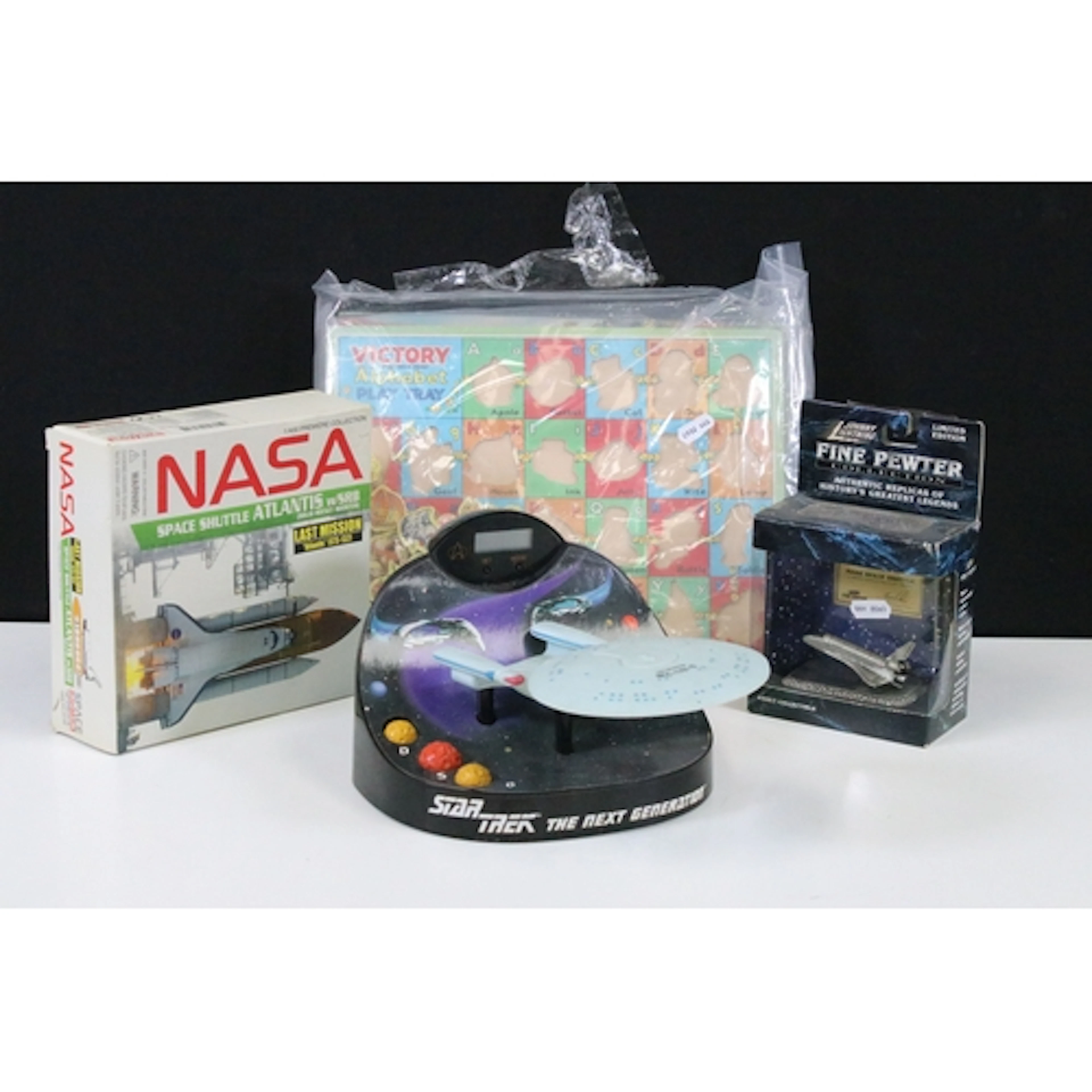 Three space themed models to include Star Trek The Next Gene...
