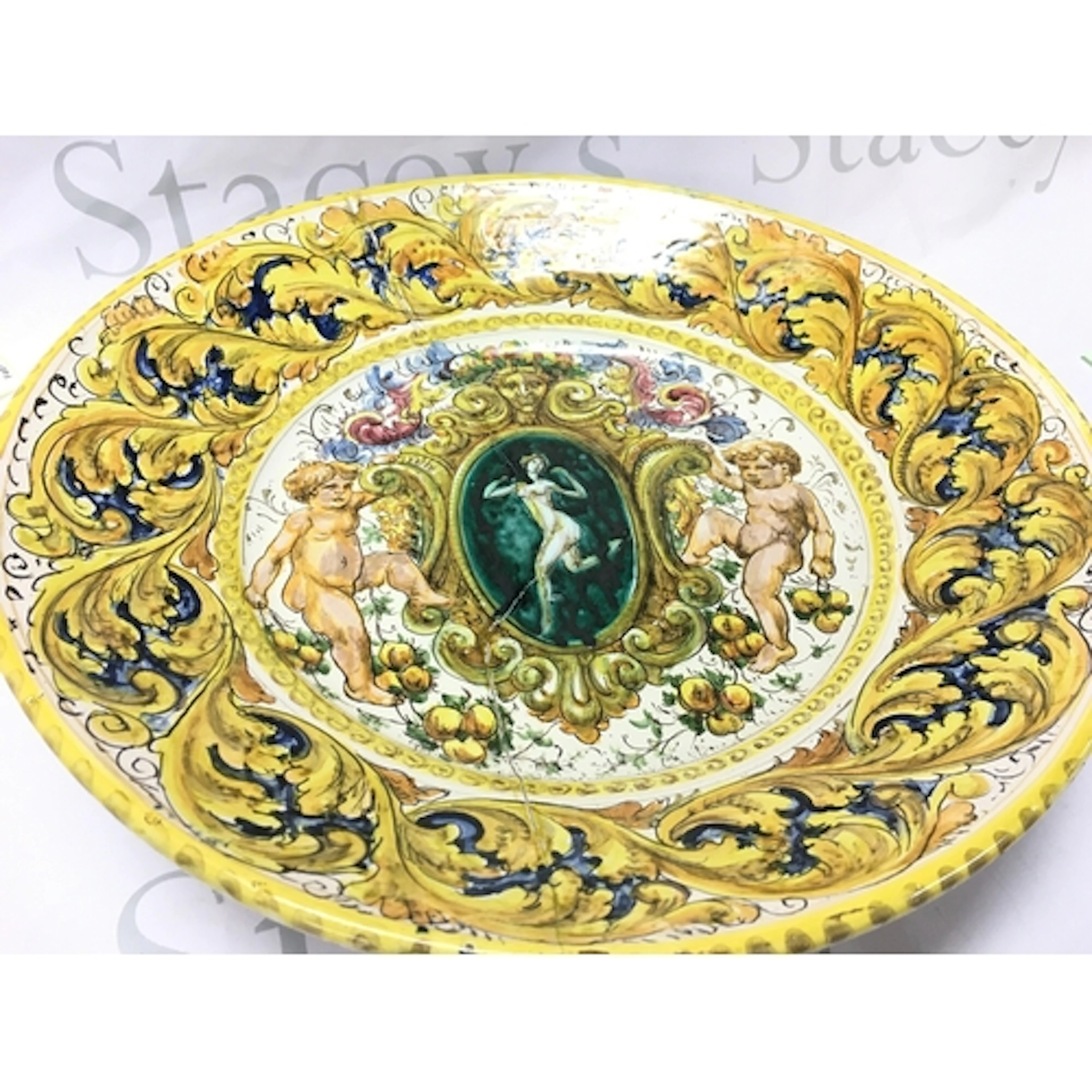 A 19th-century Italian Maiolica charger, lady and putti desi...