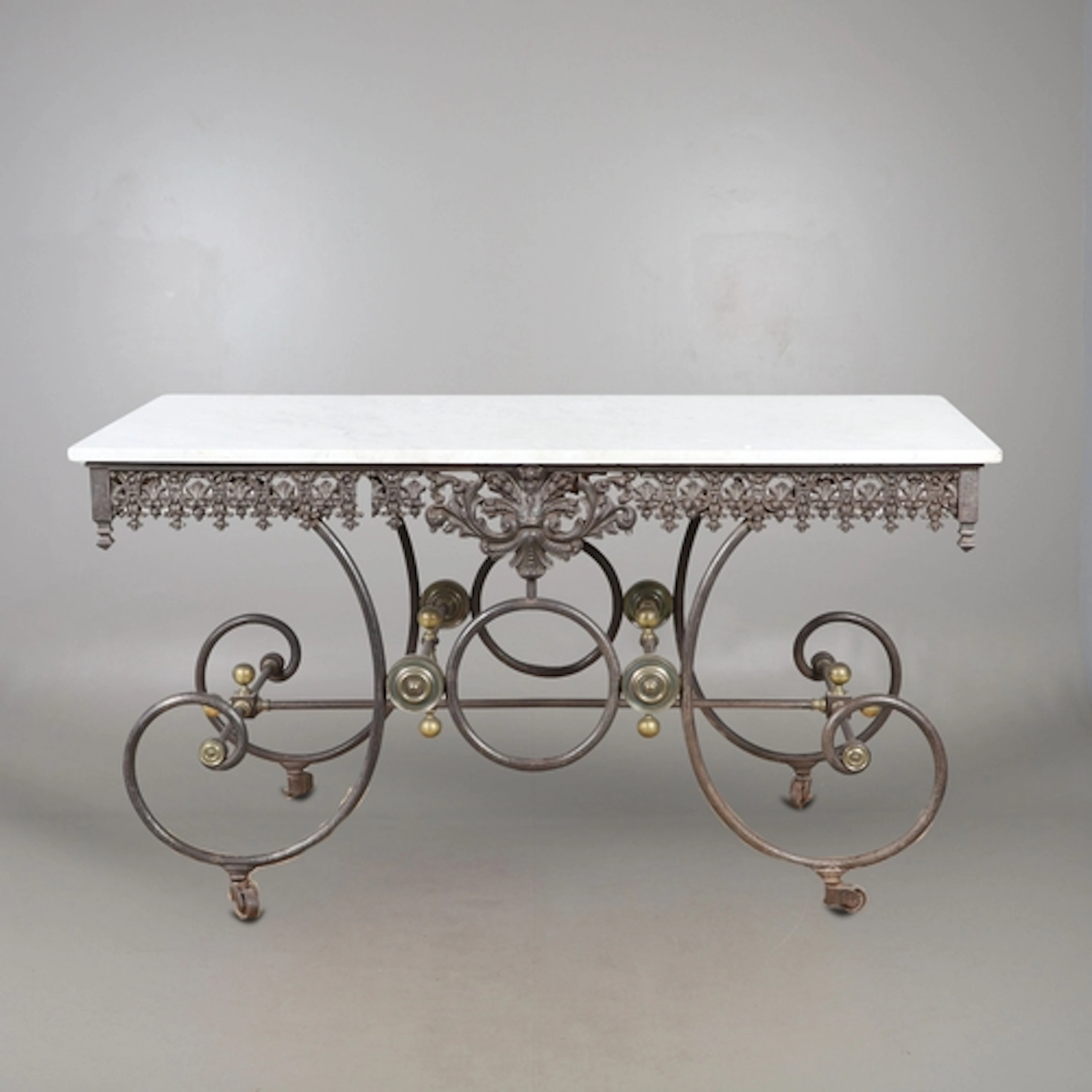 A FRENCH WROUGHT IRON AND MARBLE PATISSERIE OR CONSOLE TABLE...