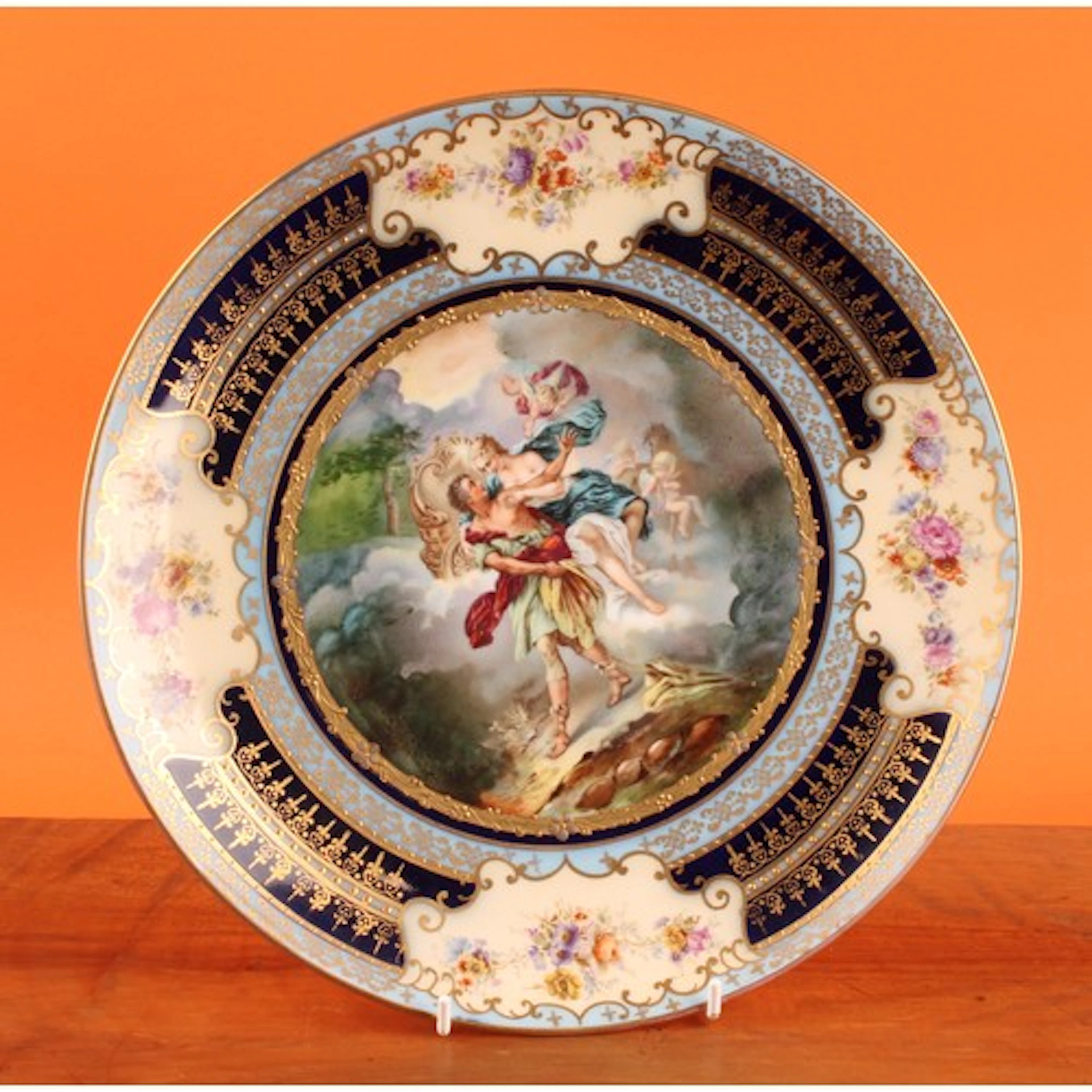 A Vienna circular charger, decorated in polychrome with Auro...