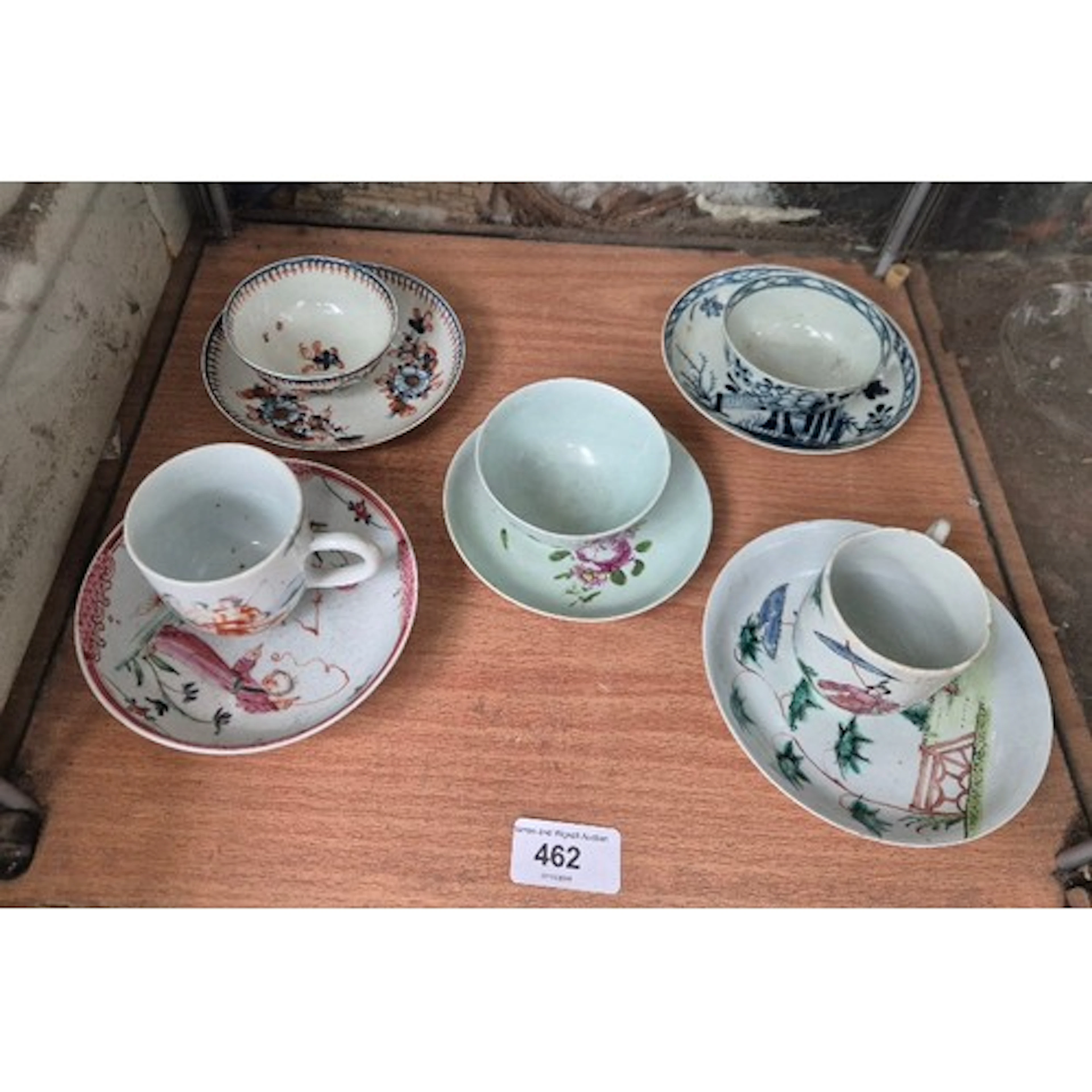 Five 18th century porcelain tea bowls and saucers.