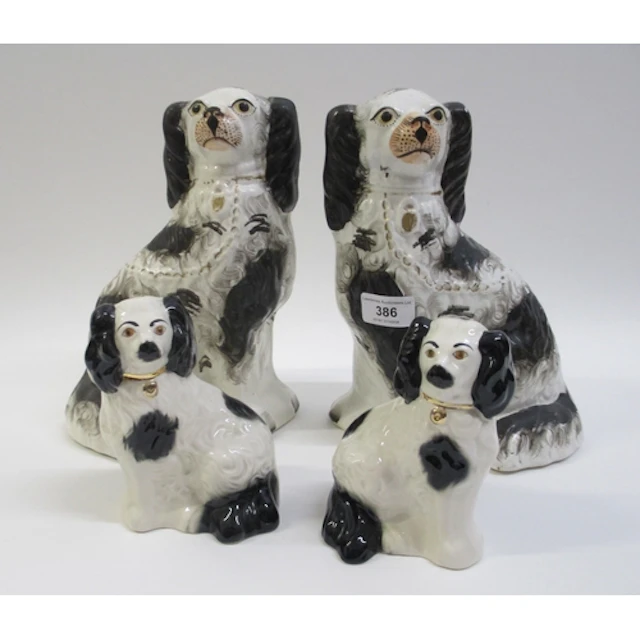 Pair of 19th Century Staffordshire figures of seated spaniel...
