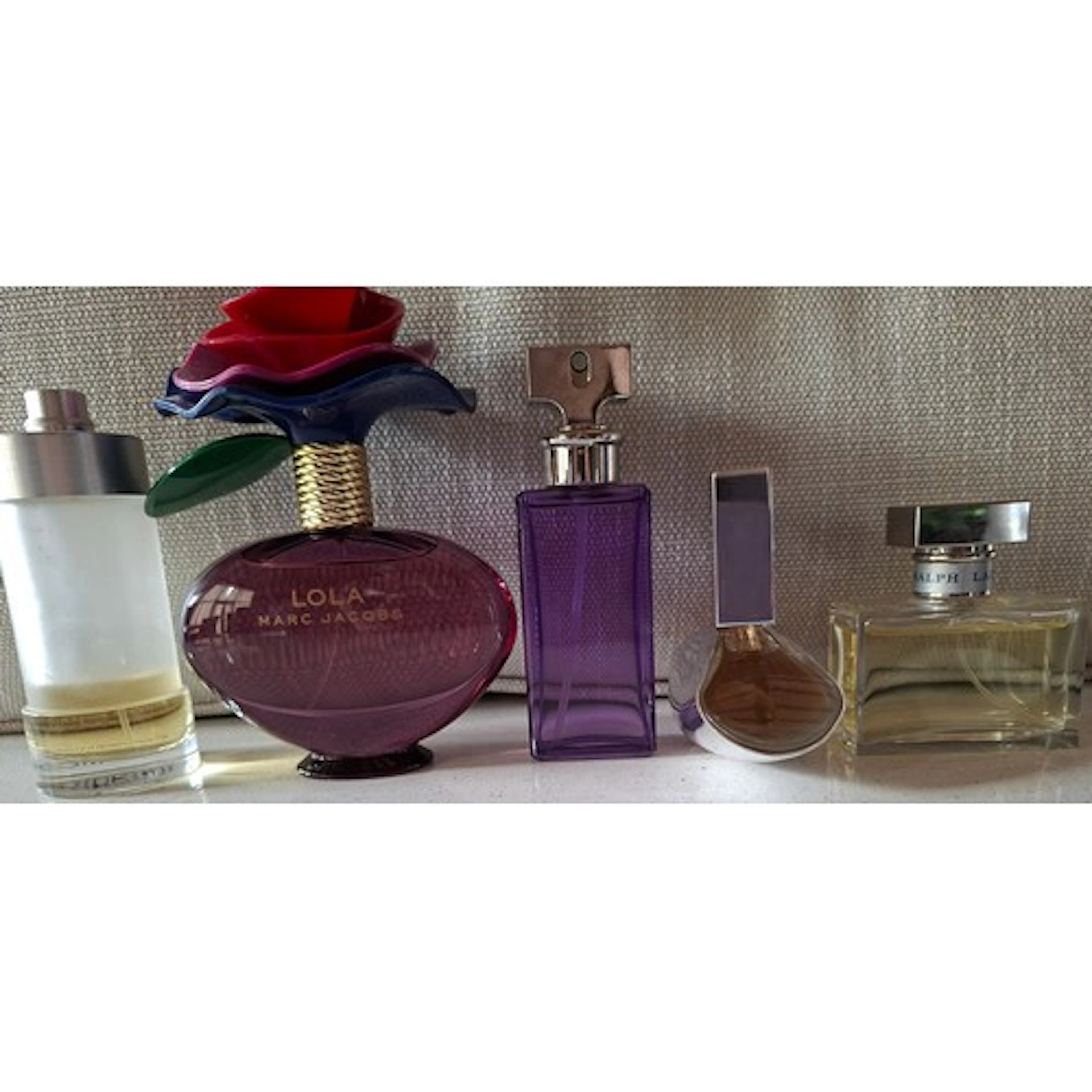 Five fragrances comprising Marc Jacobs 'Lola' Eau de Parfum ...