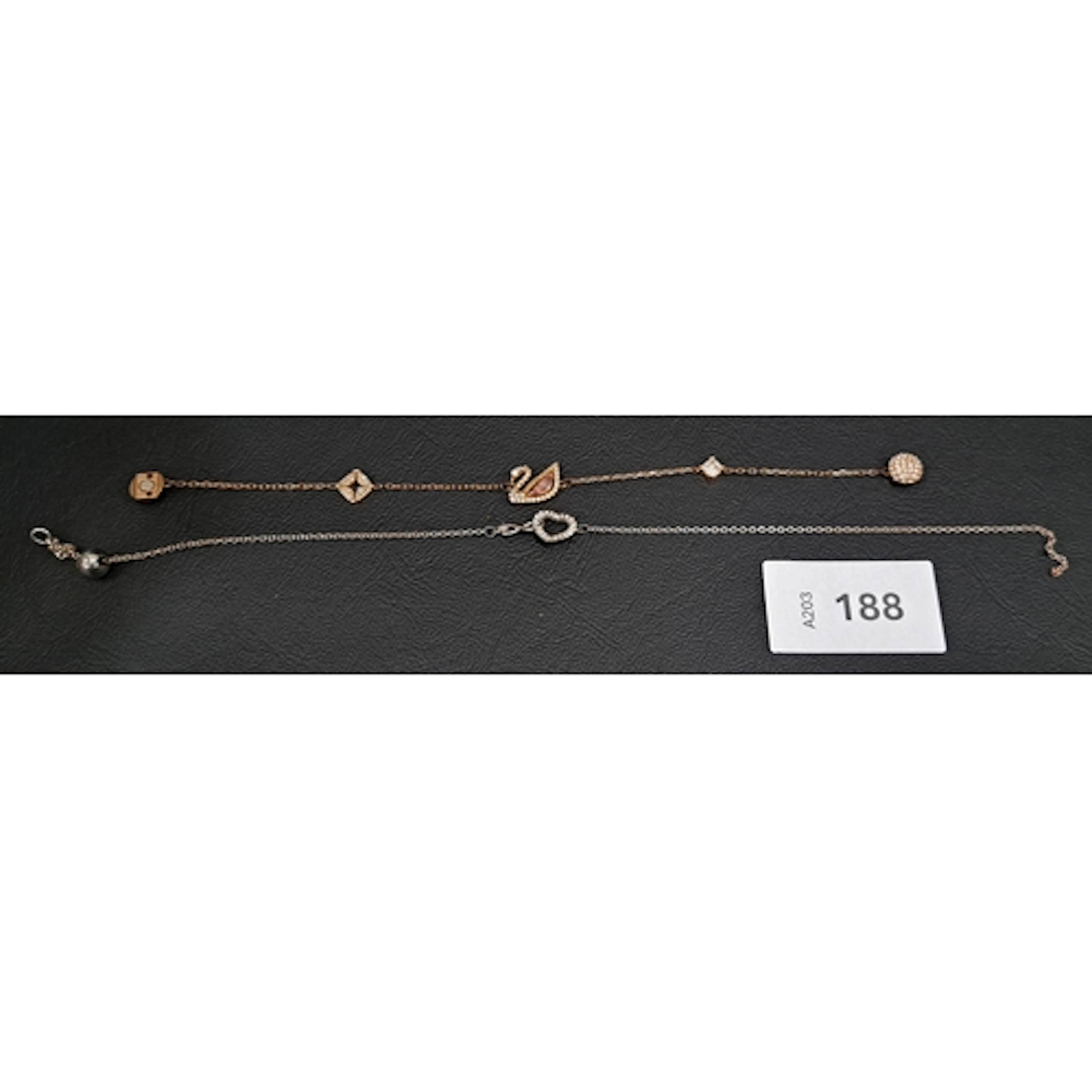 TWO PIECES OF SWAROVSKI JEWELLERY comprising a rose gold ton...