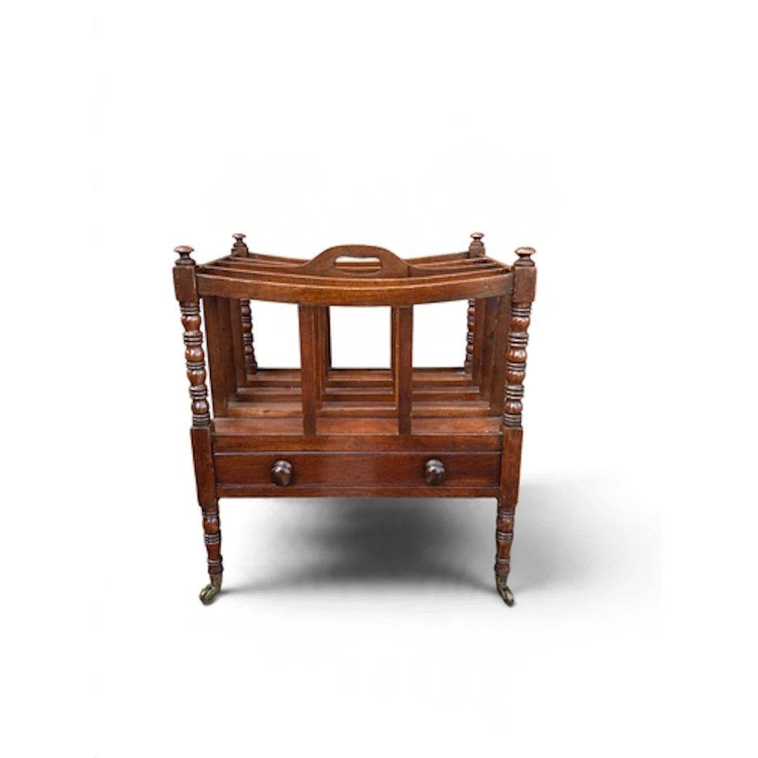 A 19TH CENTURY MAHOGANY CANTERBURY Raised on castors. 48cm x...