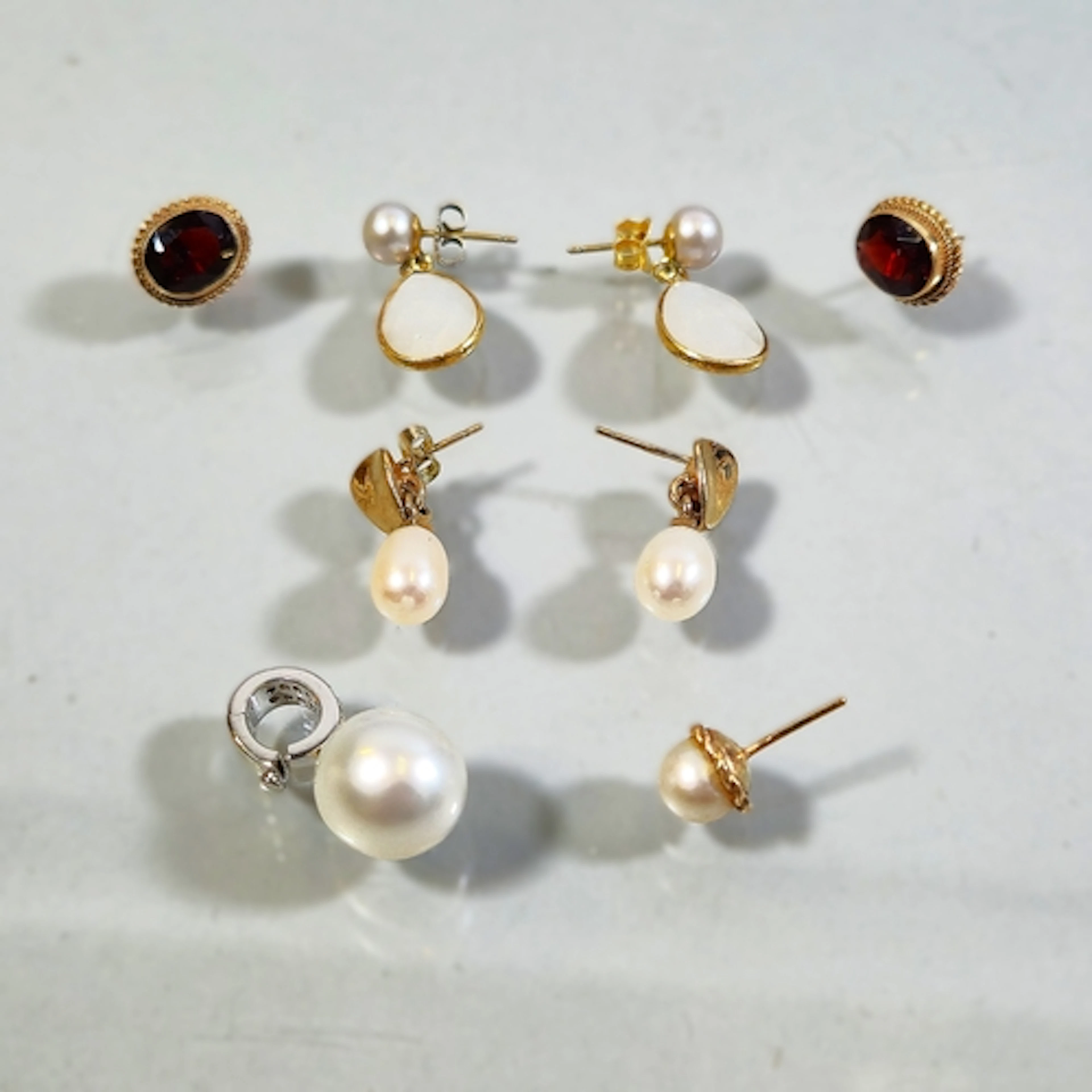 14ct white gold, diamond and freshwater pearl earring, the c...