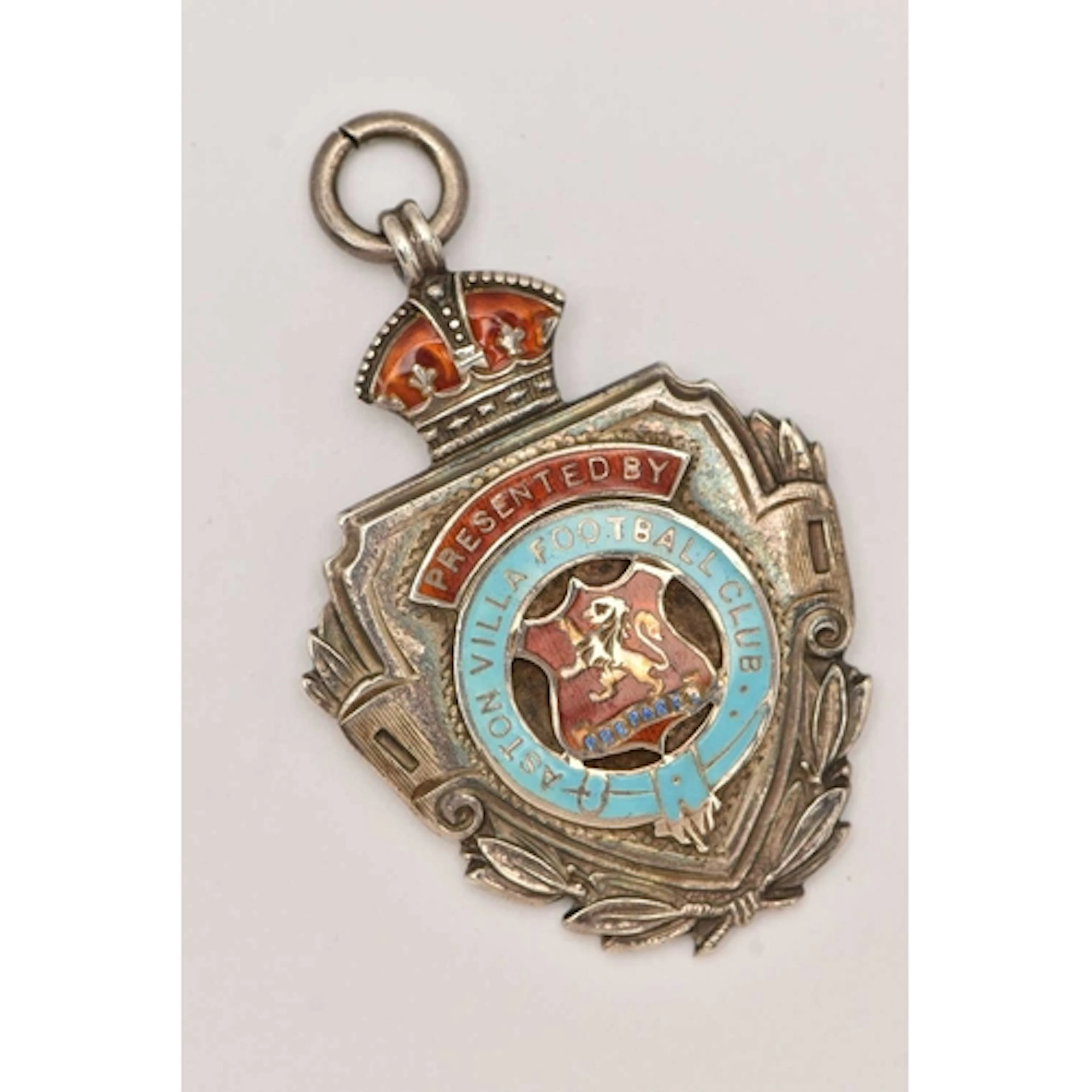 A SILVER AND ENAMEL ASTON VILLA MEDAL, a shield form medal w...
