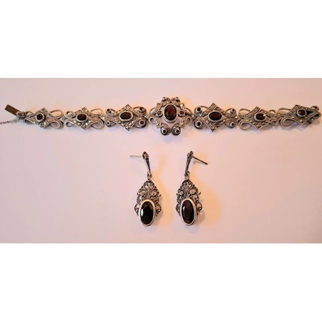 A silver, marcasite and red stone bracelet makers mark DK wi...