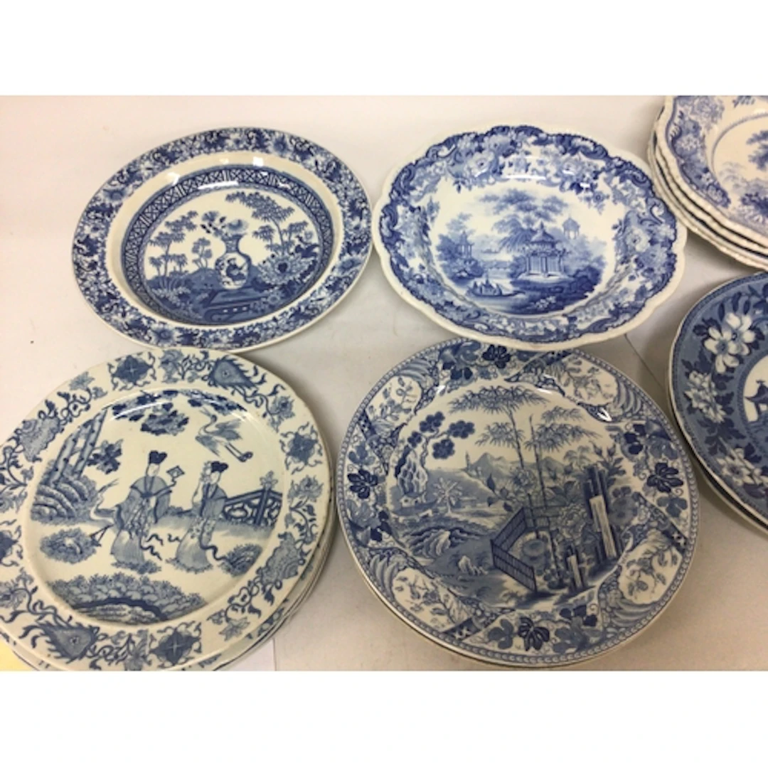 A collection of Victorian blue and white dishes and plates d...